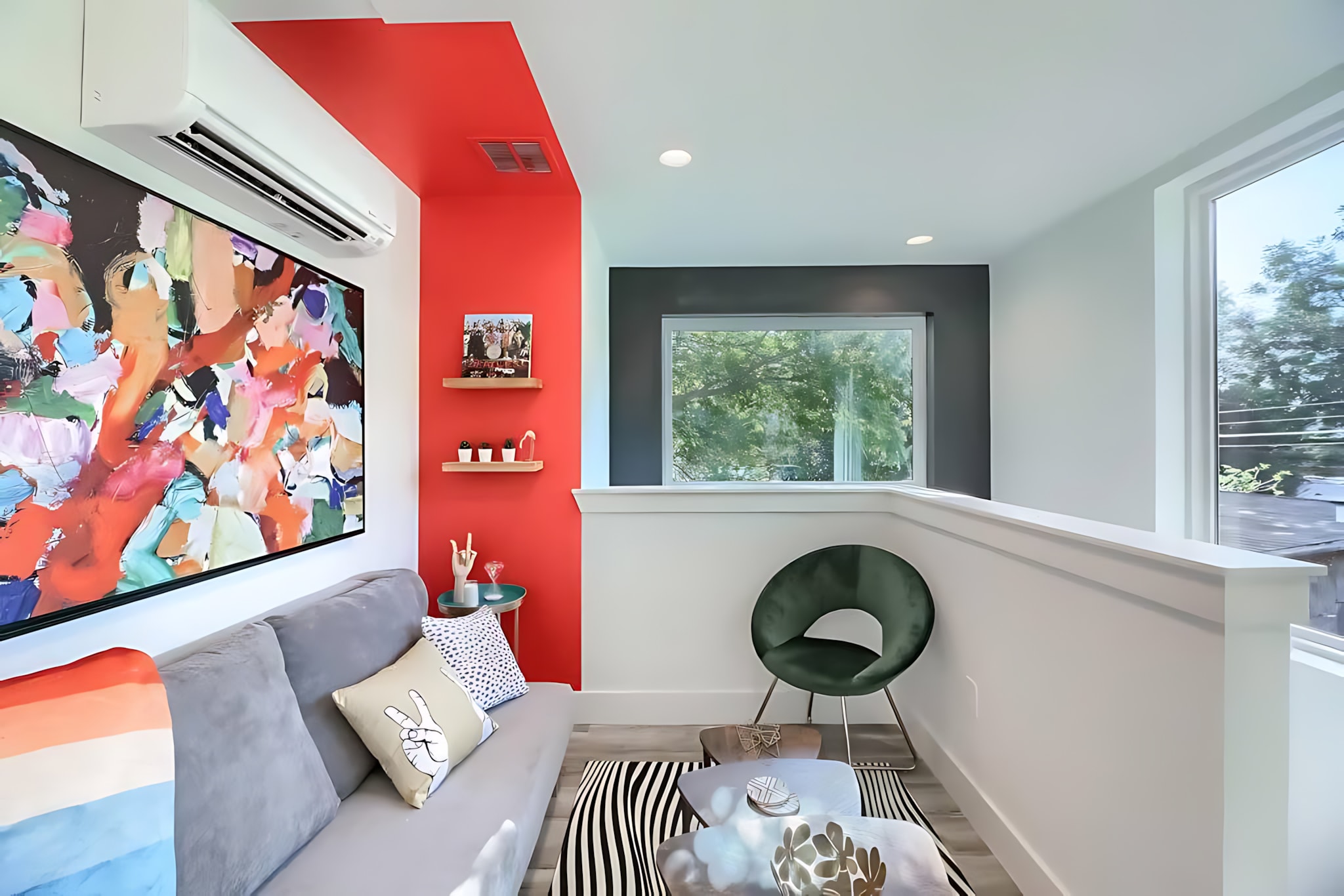 Cozy Living Space With Modern Art, Vibrant Color Accents, And A Comfortable Sofa Bed