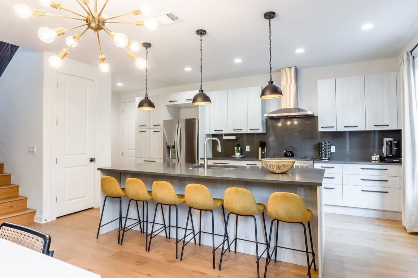 Spacious Kitchen With Island And Bar Seating