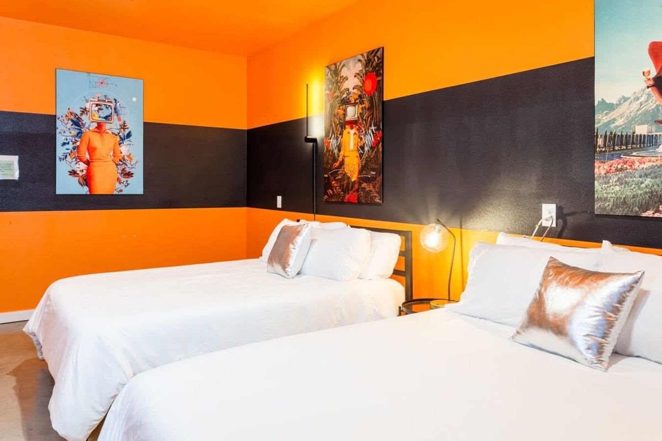 Bright, Modern Room With Queen Beds And Unique Wall Art
