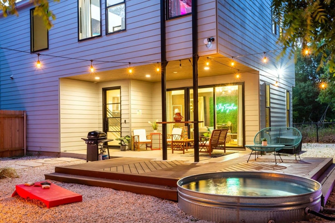 Cozy Outdoor Space With A Cowboy Pool And Seating Area