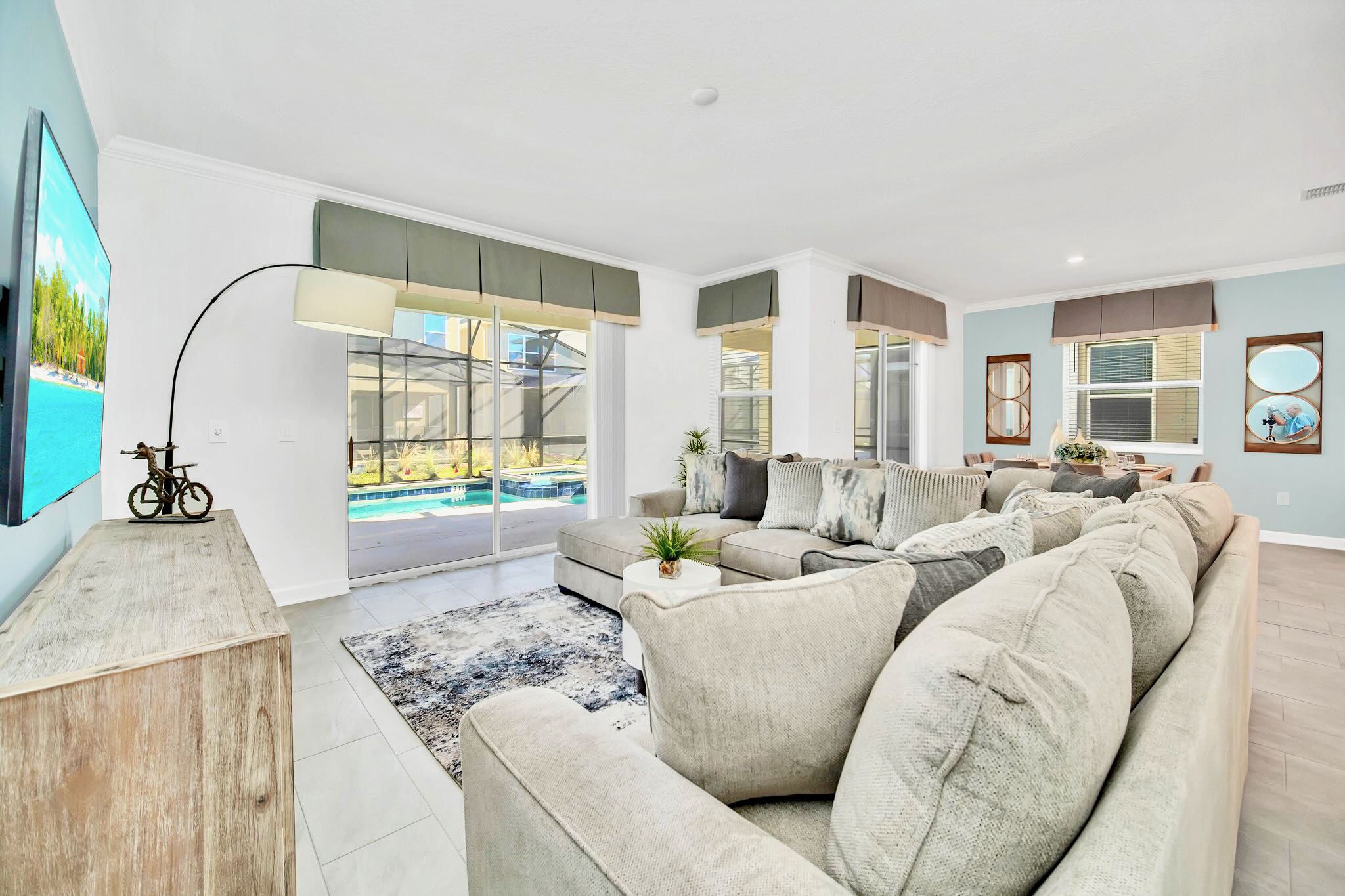 Spacious Living Room With Pool Views And Elegant Decor