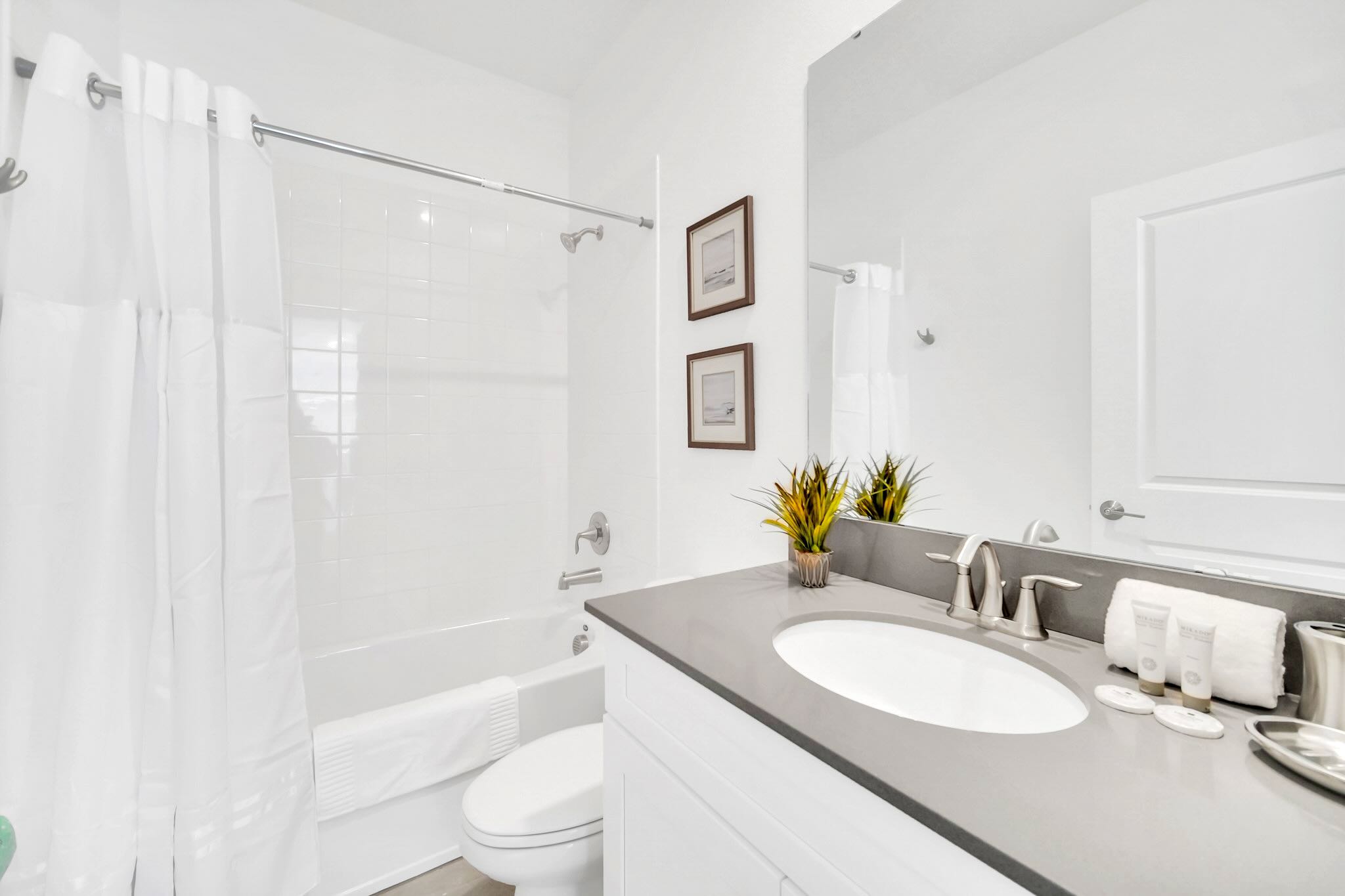 Refresh In This Modern Bathroom With A Spacious Shower