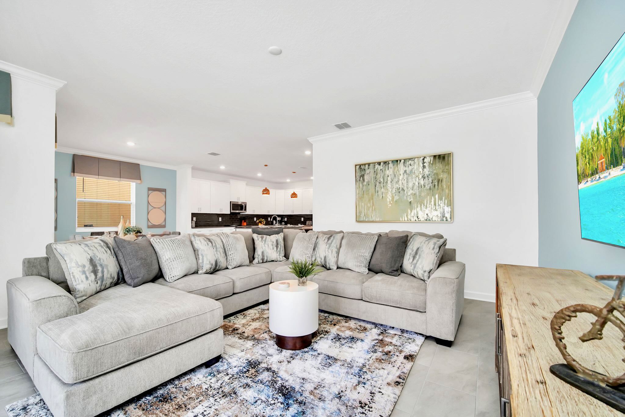 Relax In This Spacious Living Room With A Stylish Sectional Sofa