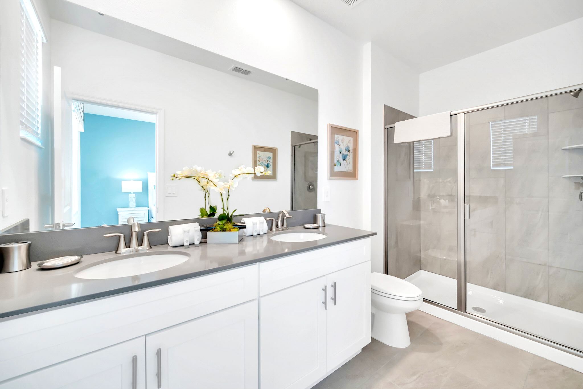 Refresh In This Modern Bathroom Featuring A Walk-In Shower And Double Vanity