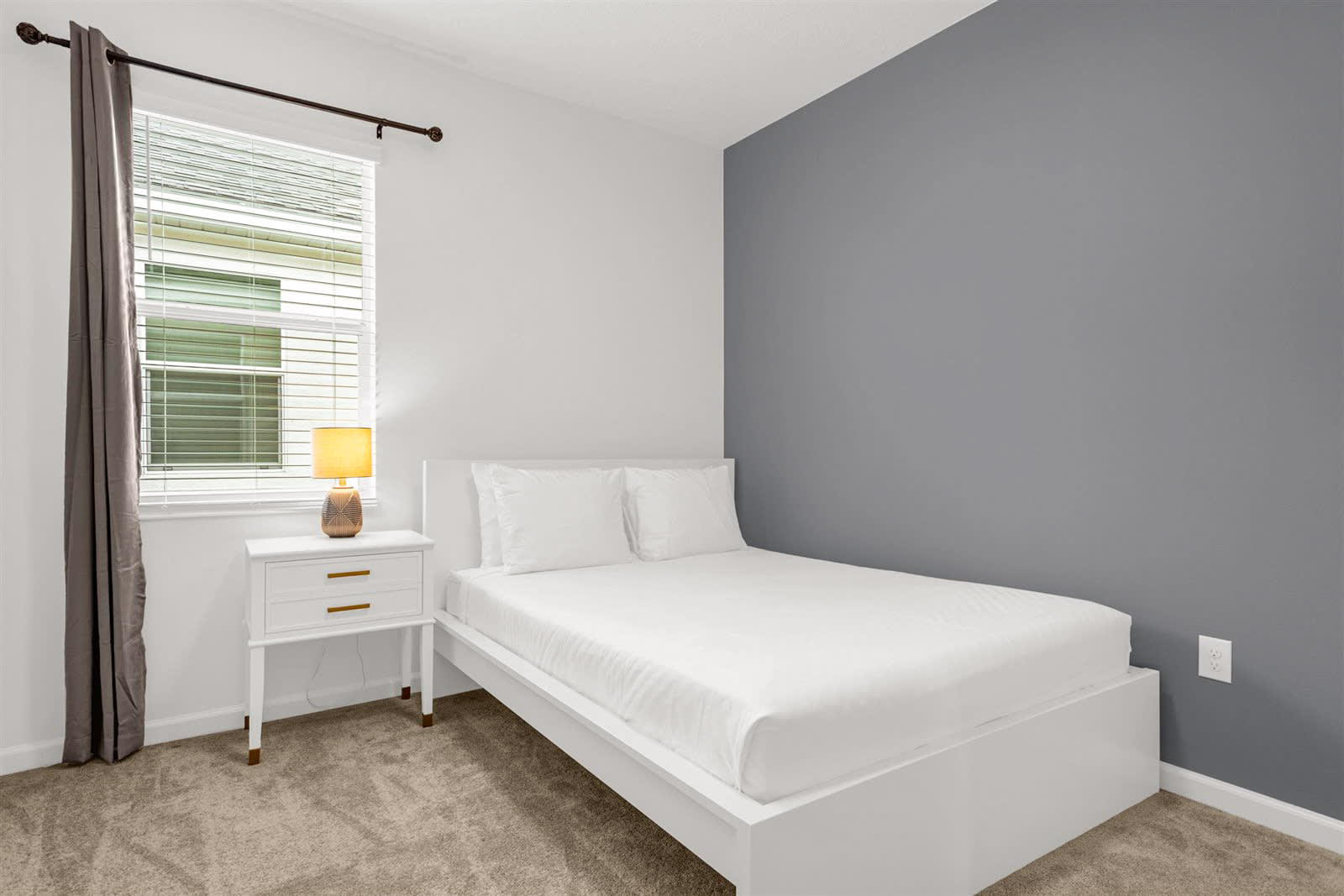 Queen Bedroom With A Clean White Aesthetic And Ample Lighting