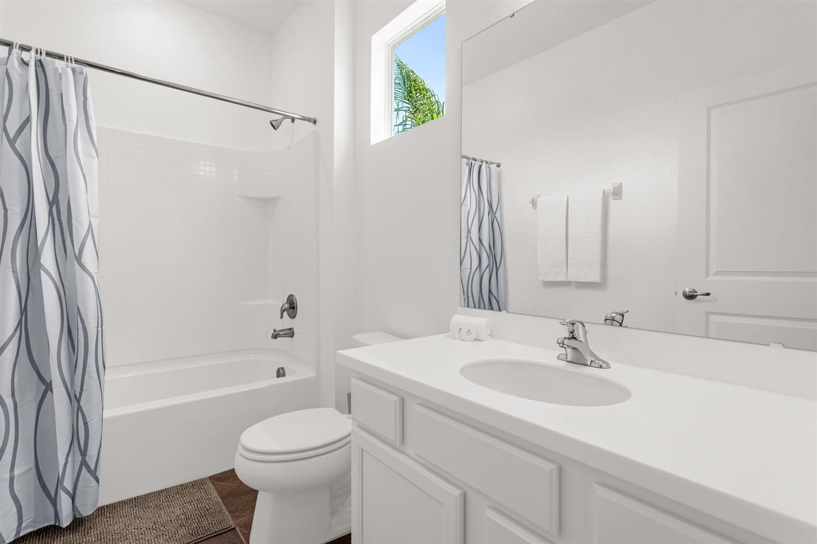 Bright Bathroom With Full Shower And Clean Minimalist Design