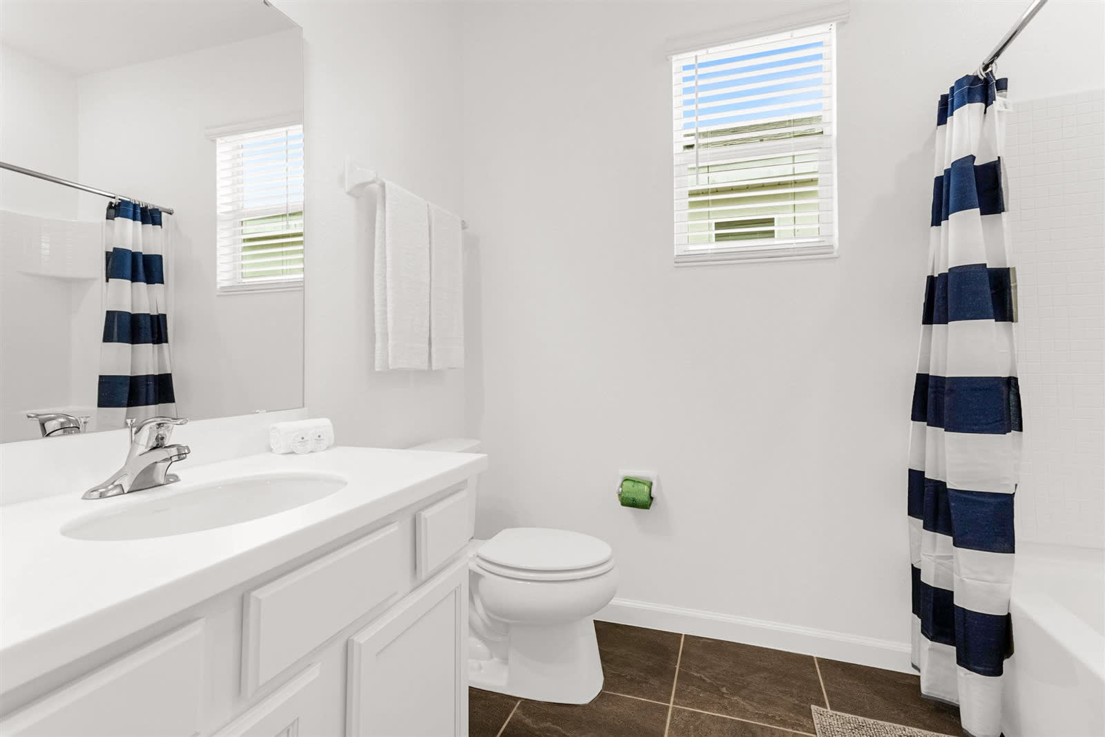Bright Bathroom With Nautical-Themed Striped Shower Curtain