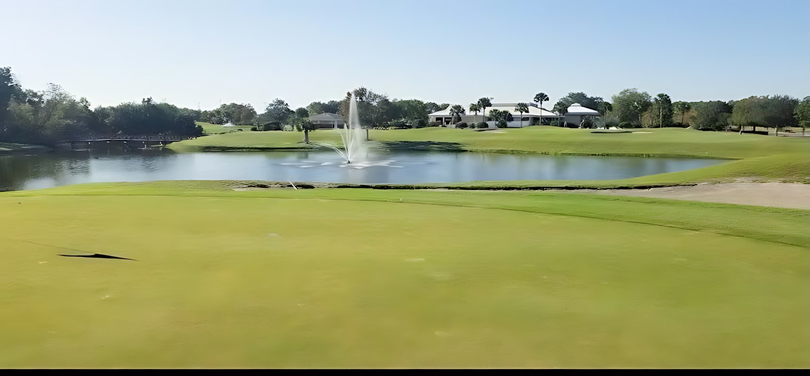 Practice Your Skills On The Well-Maintained Putting Green With Fountain Views