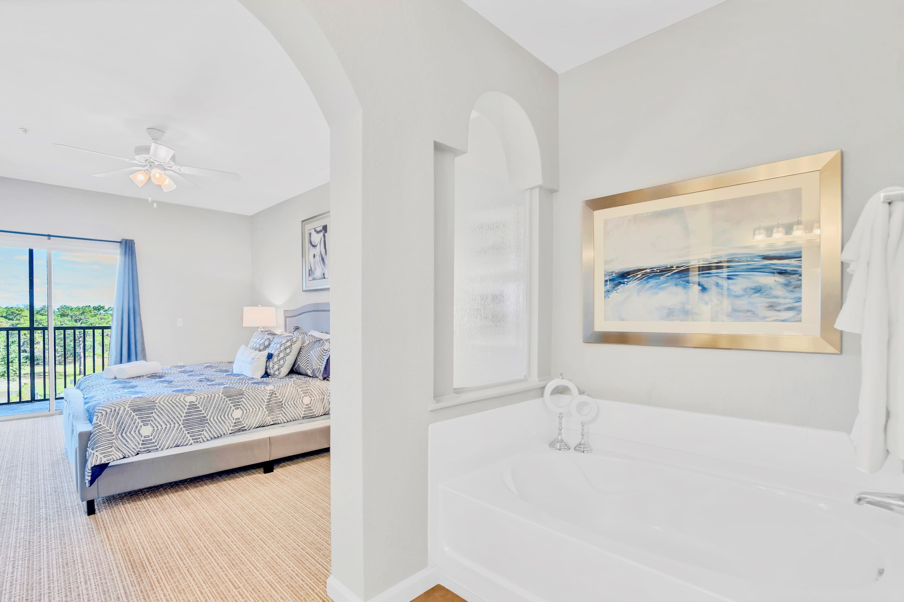 Spacious Ensuite Bathroom Featuring A Relaxing Soaker Tub And Sleek Design