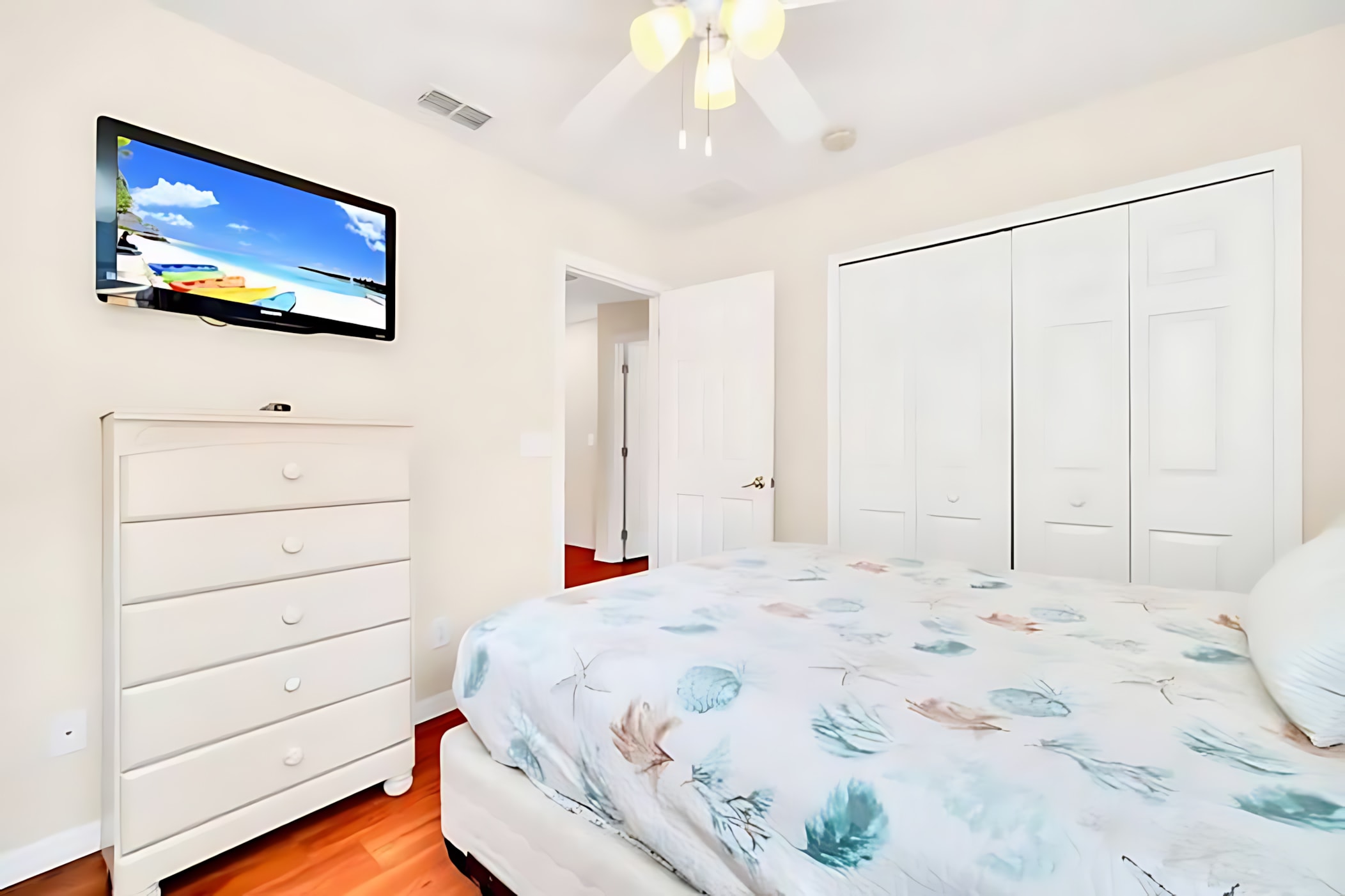 Queen Bedroom With Nautical Decor And Smart TV For Entertainment