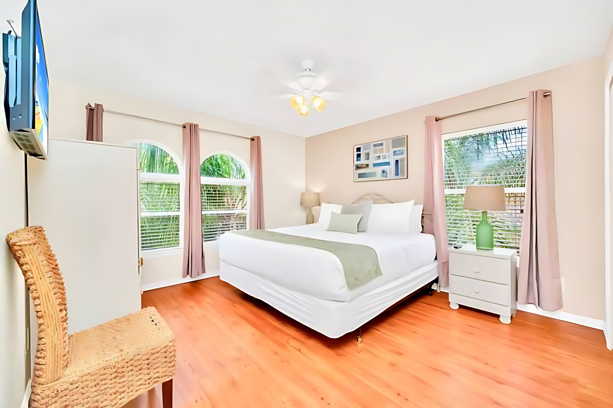 King Bedroom With Abundant Natural Light And Garden Views