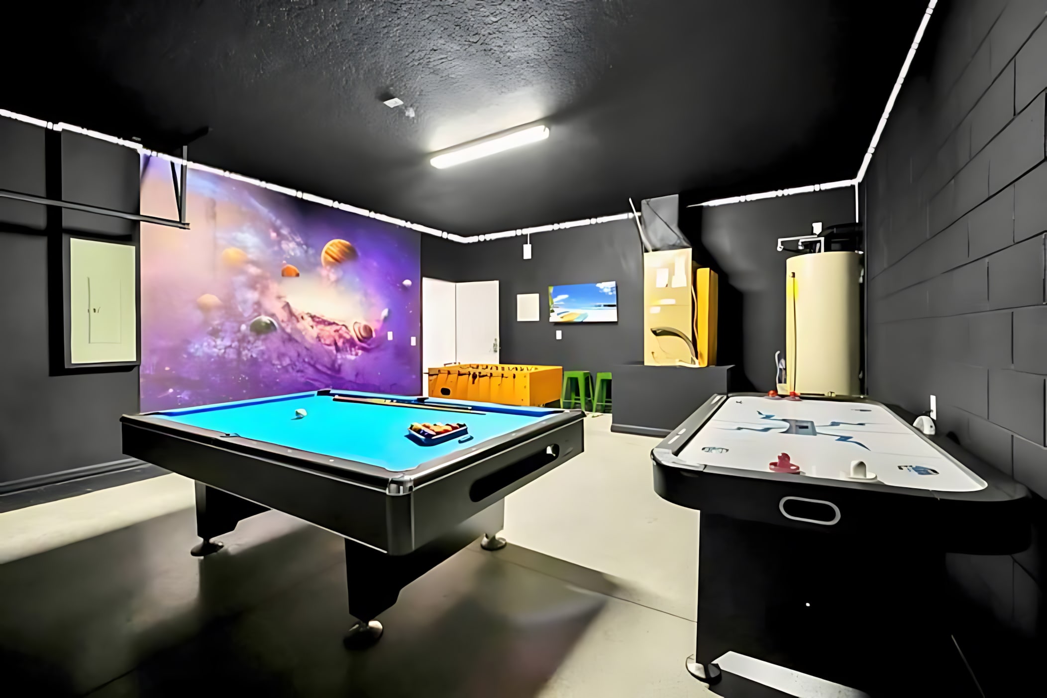 Dynamic Games Room Featuring Air Hockey, Foosball, And Stylish Decor