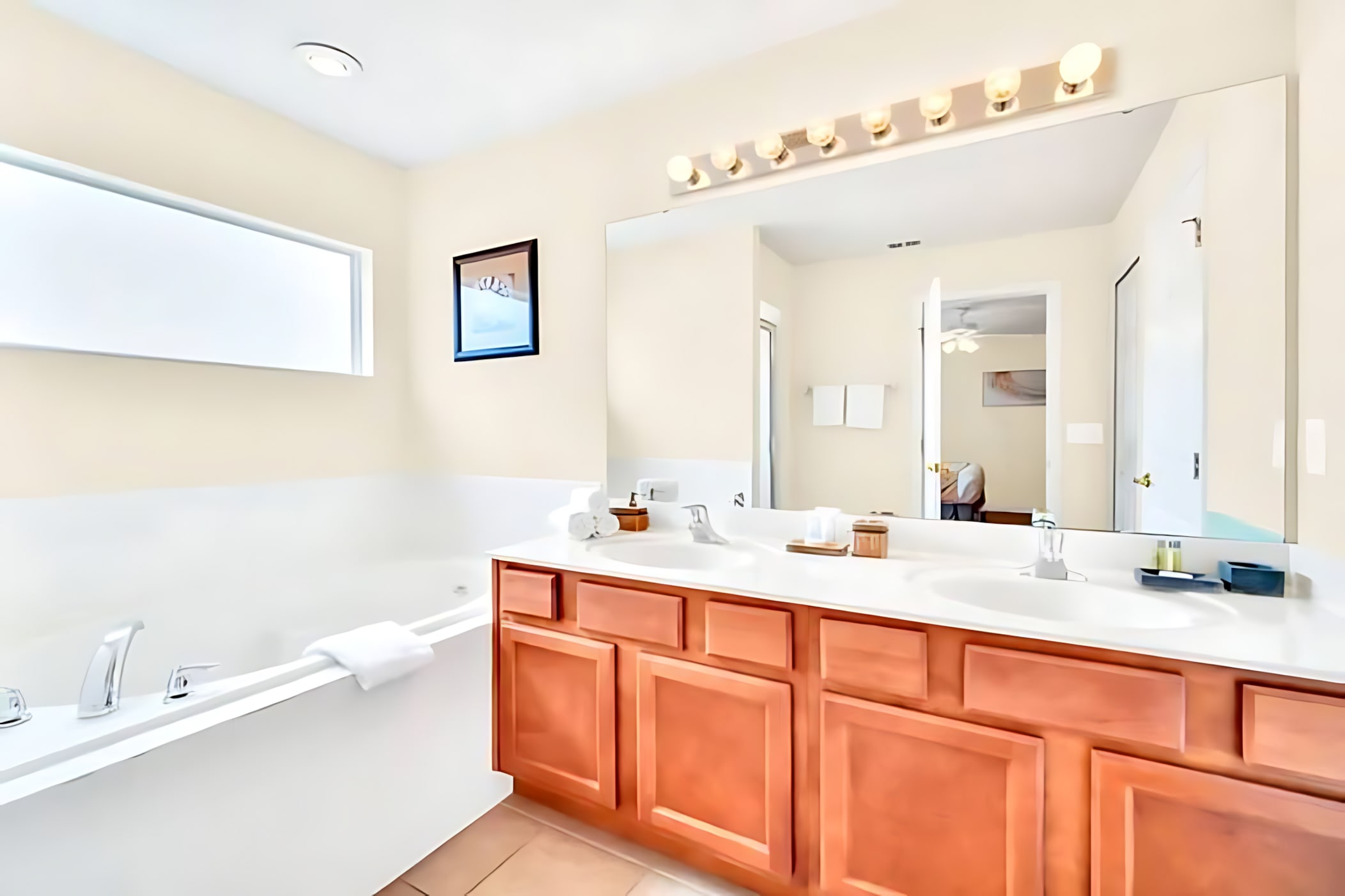 Luxurious Master Bath Featuring Dual Vanities And Granite Countertops