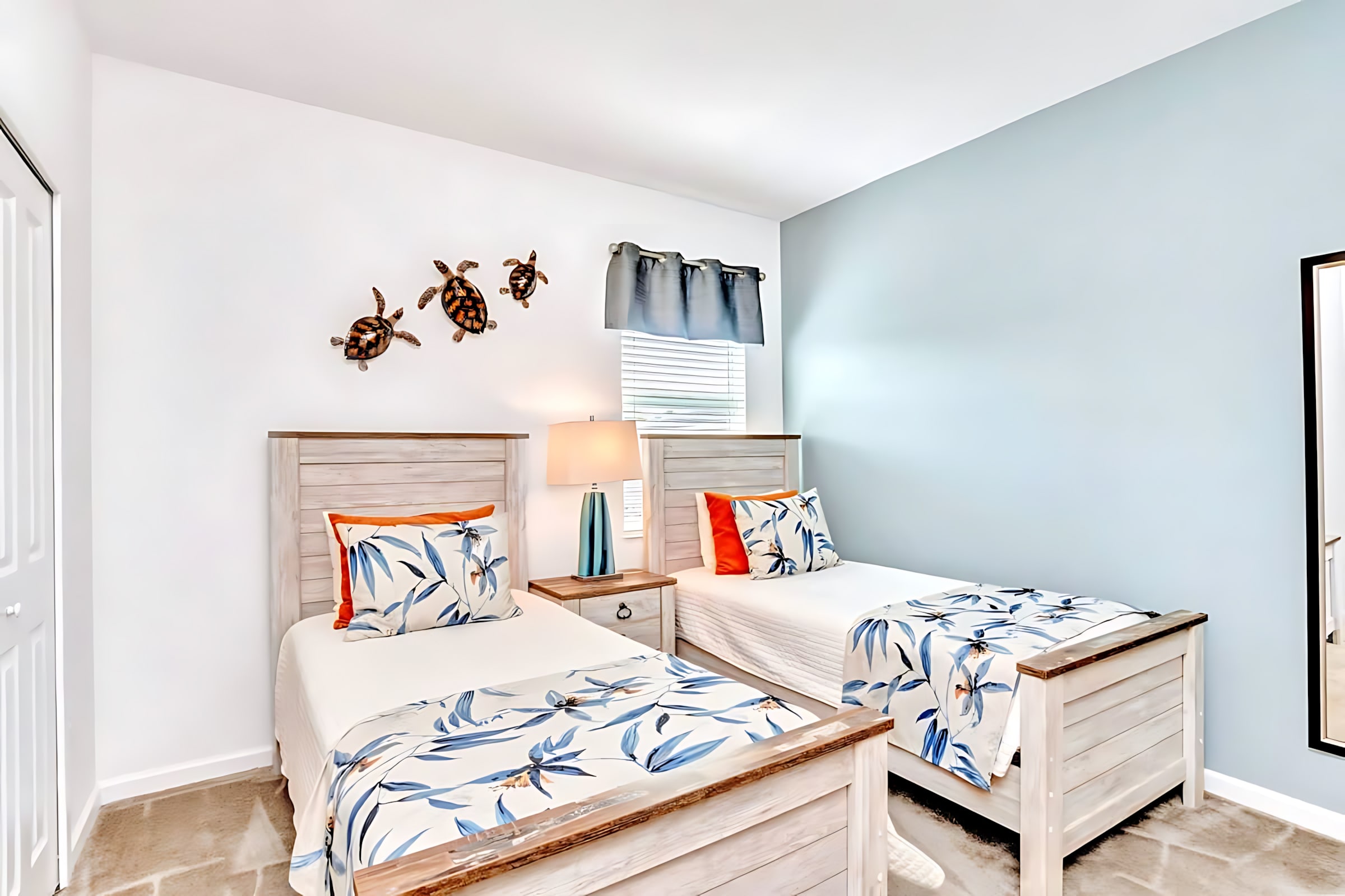 Charming Bedroom With Twin Beds And Vibrant Decor