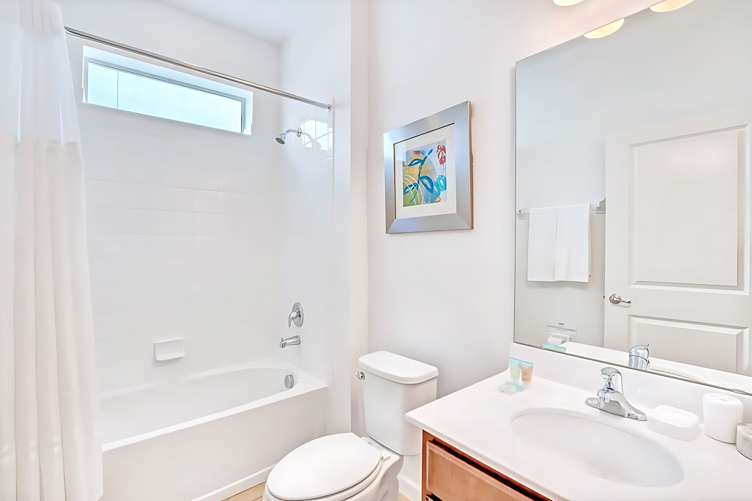 Bright Bathroom With Shower And Sparkling Finishes
