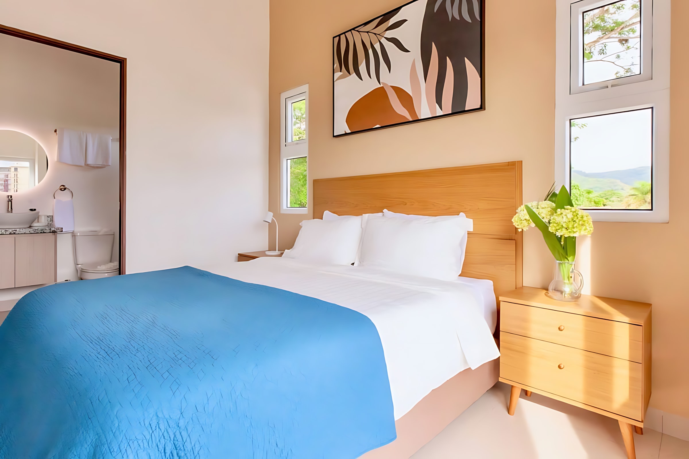 Serene Bedroom With A Plush Queen Bed And Artistic Details