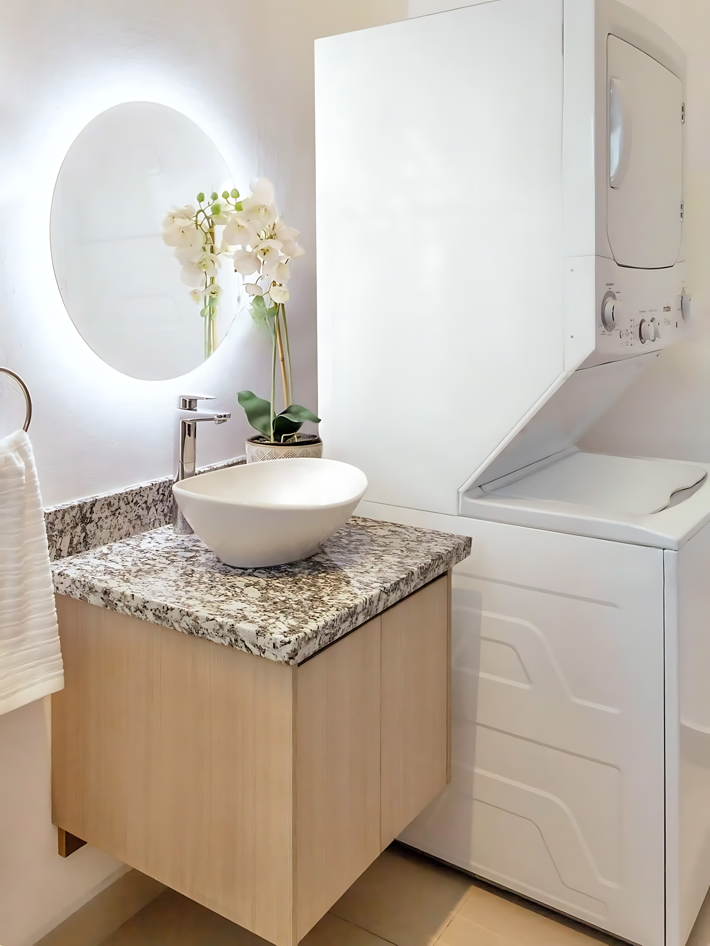 Convenient In-Suite Laundry With Stylish Sink And Practical Amenities