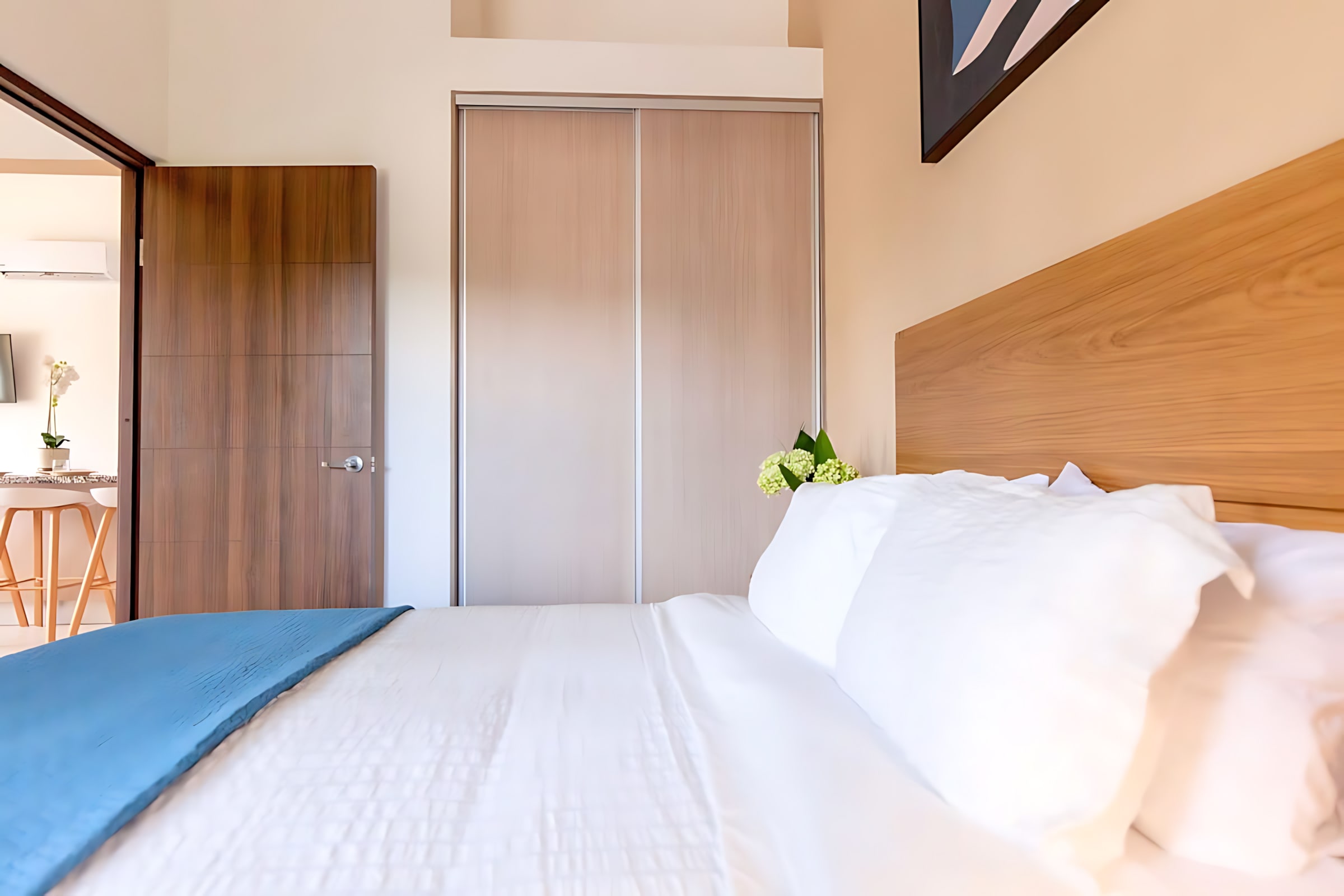 Peaceful Retreat Featuring Plush Bedding And Warm Natural Tones