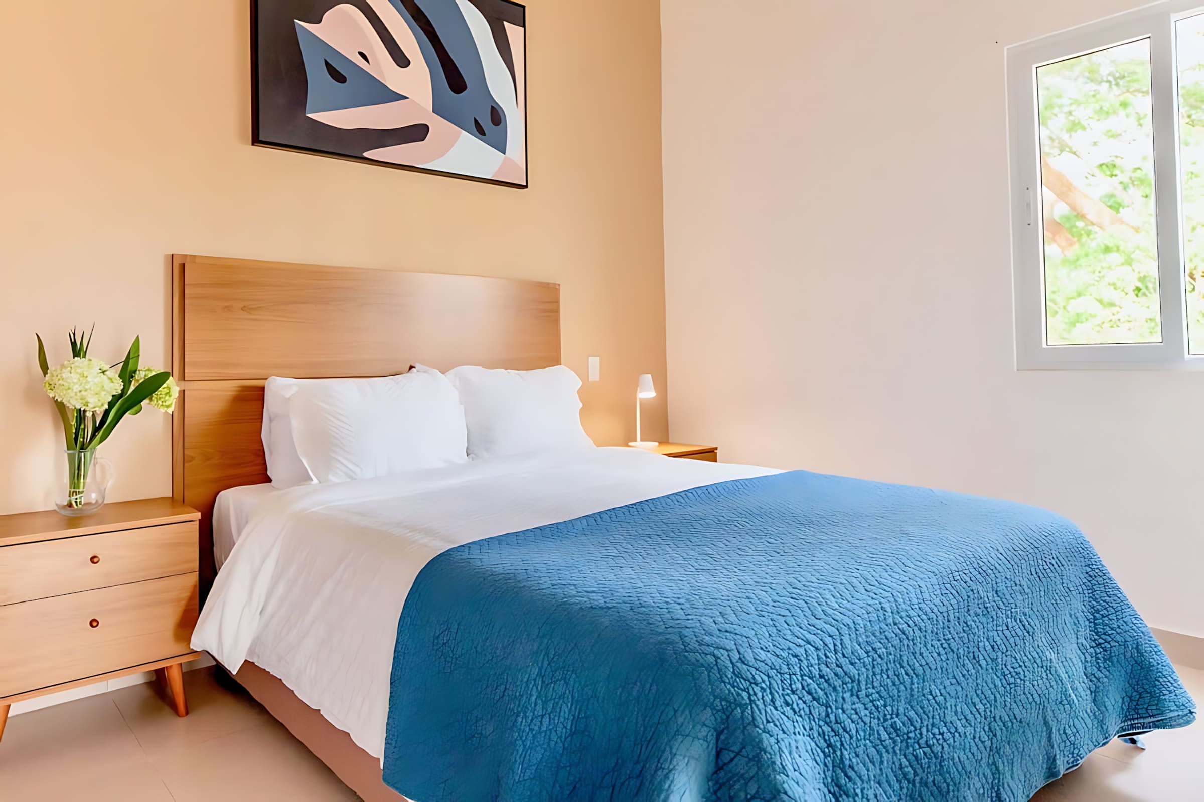 Tranquil Bedroom With A Queen Bed And Minimalist Decor