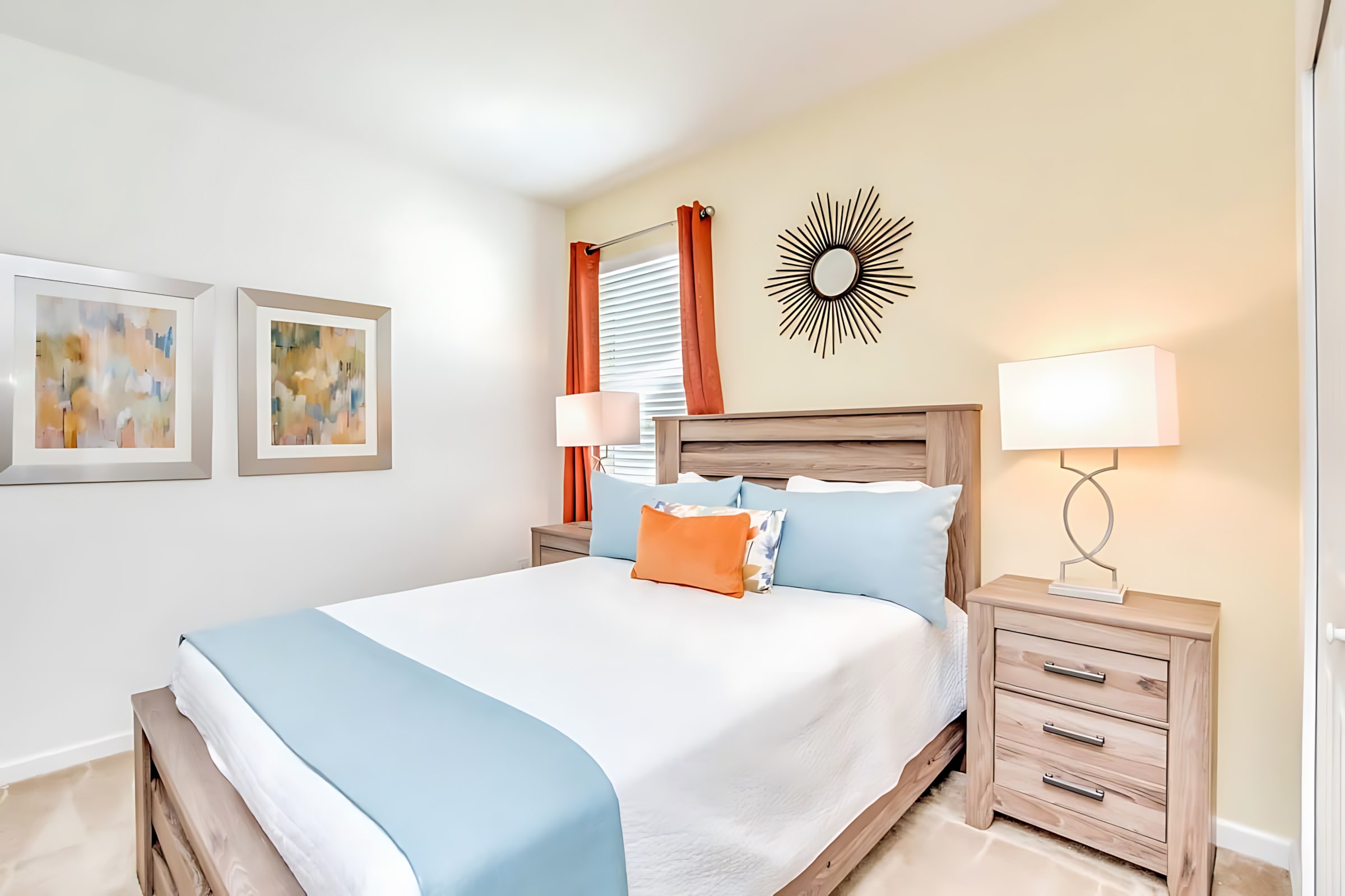 Bright And Comfortable Bedroom Featuring A Queen Bed And Natural Light