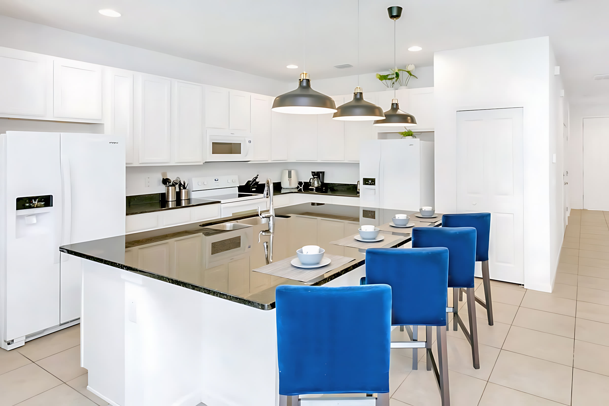 Fully Equipped Kitchen Featuring Modern Appliances And Elegant Design