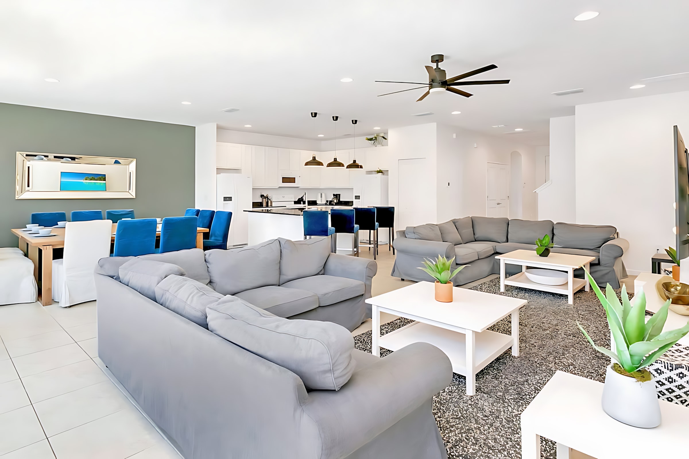 Spacious Open Living Area With Plush Sectional Sofa And 65