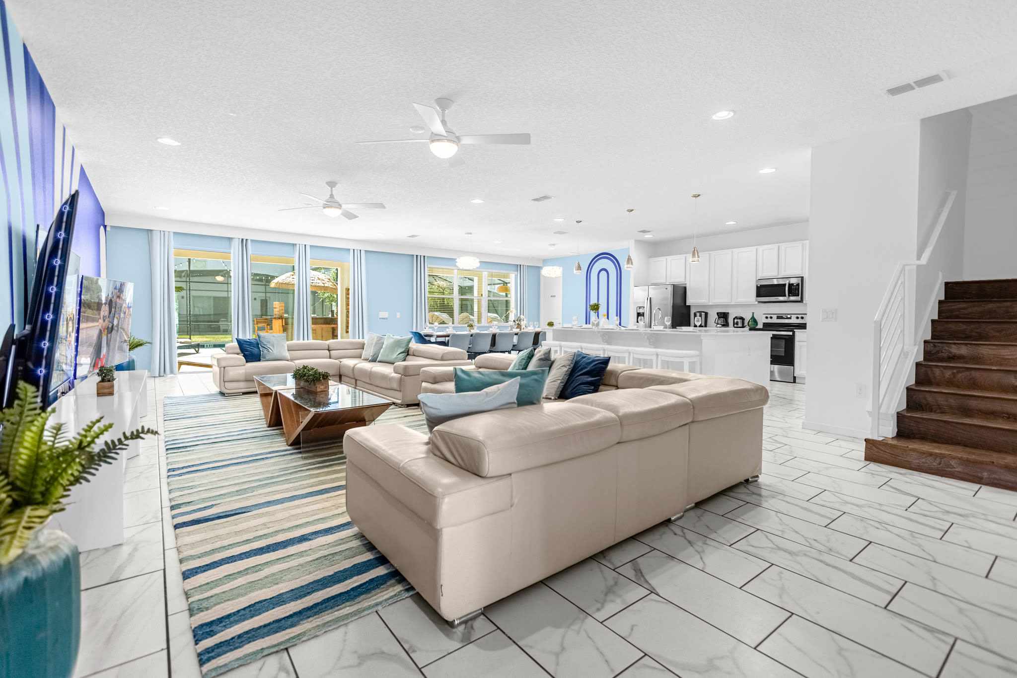 Spacious Large Capacity Living Room with Multiple Flat Screen TVs