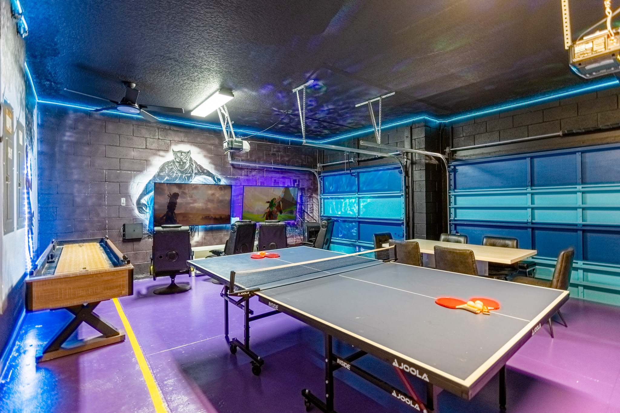 Garage-turned-games-room with air hockey, foosball, game consoles and more!