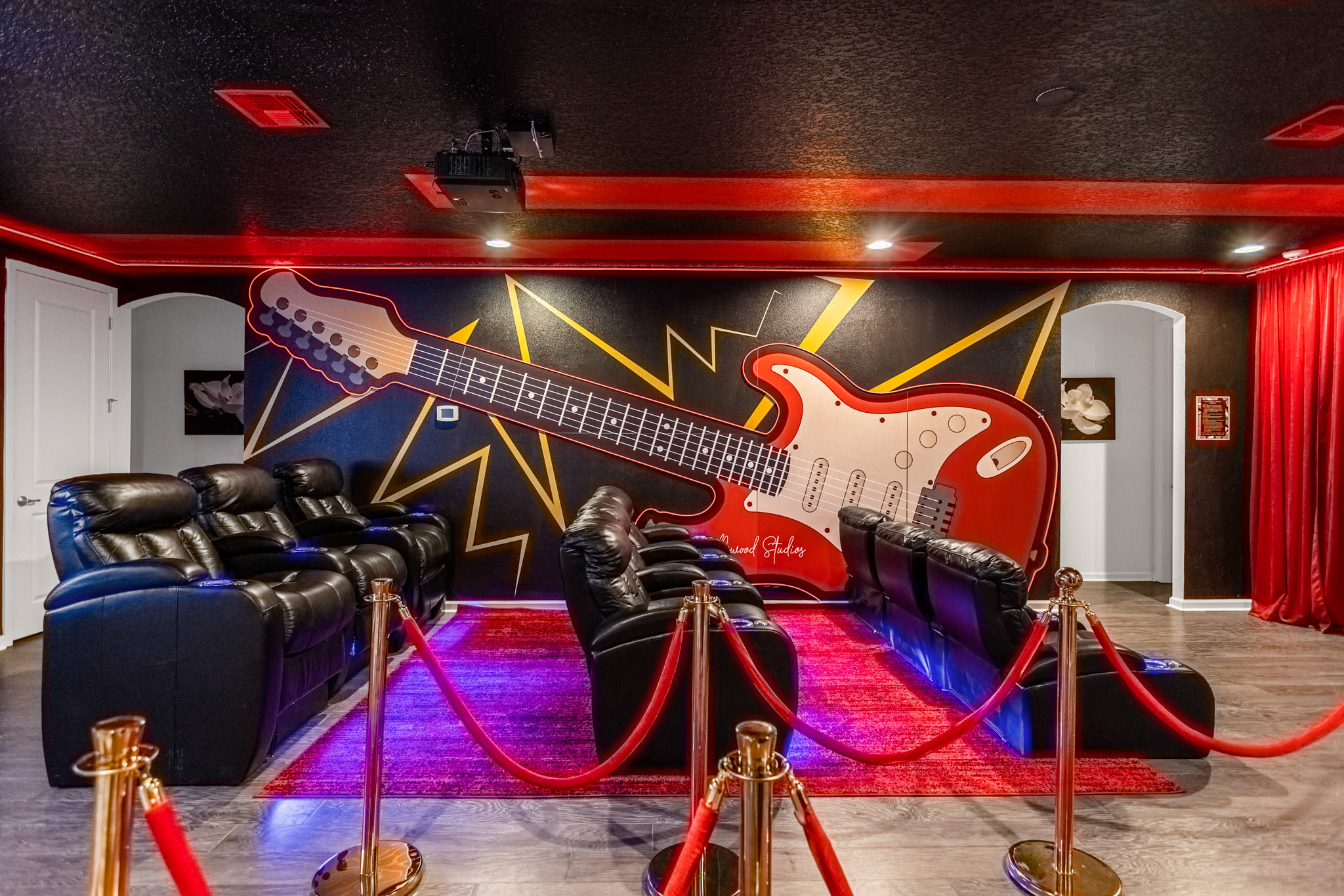 Private Movie Theatre with giant projection screen and cinema style recliners