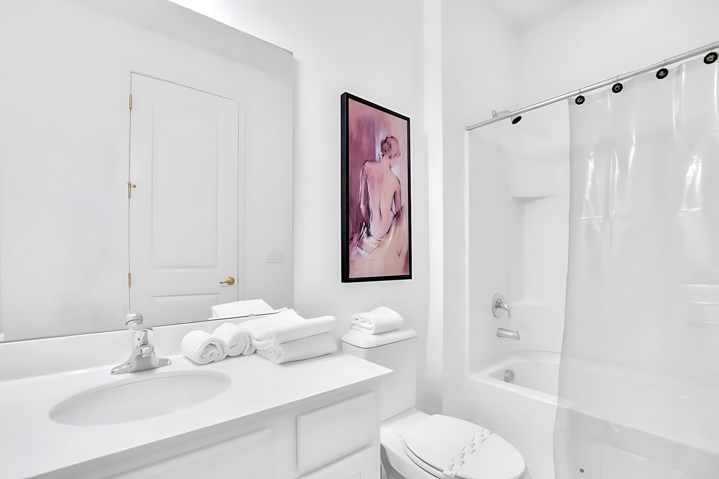 Bright Bathroom Featuring A Shower And Artistic Decor