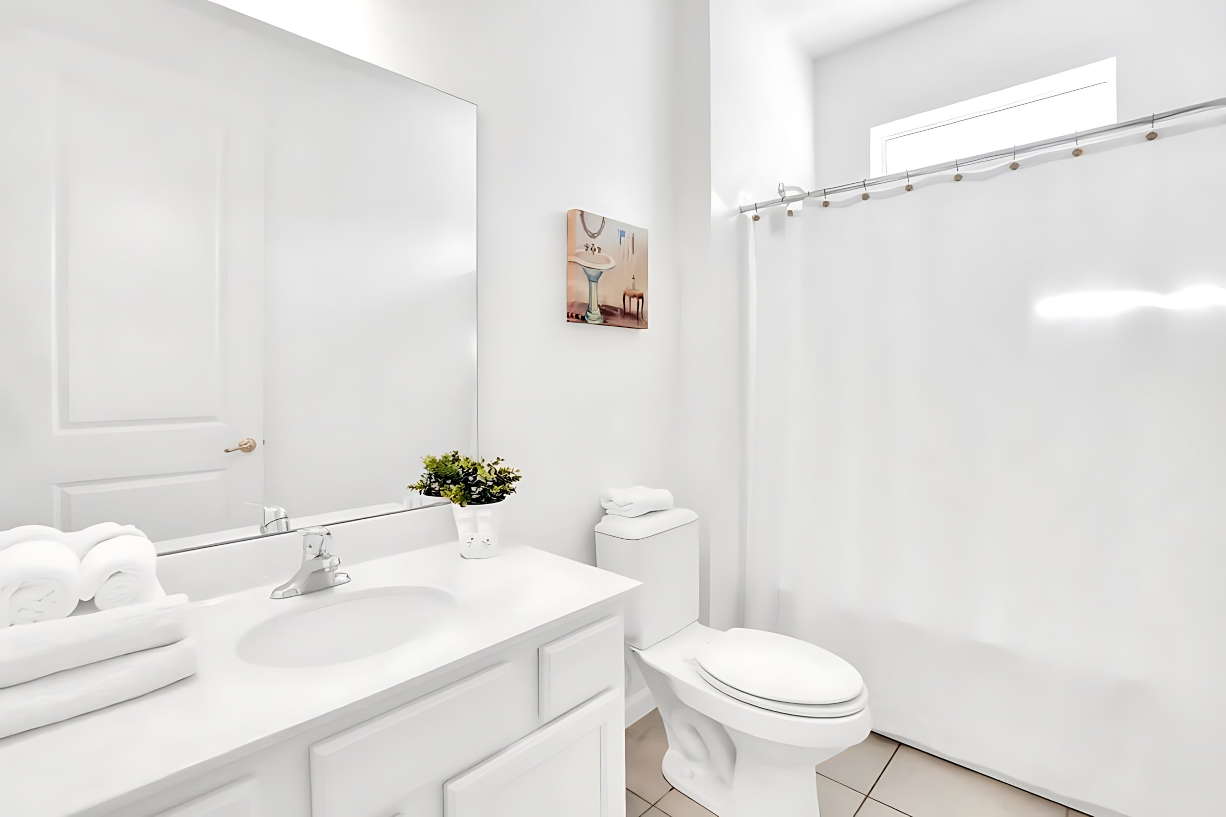 Bright Bathroom Featuring A Shower And Artistic Decor