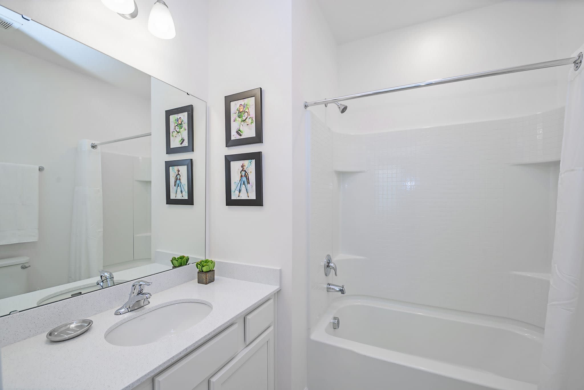 Bright Bathroom Featuring A Shower And Tub Combination With Clean Design