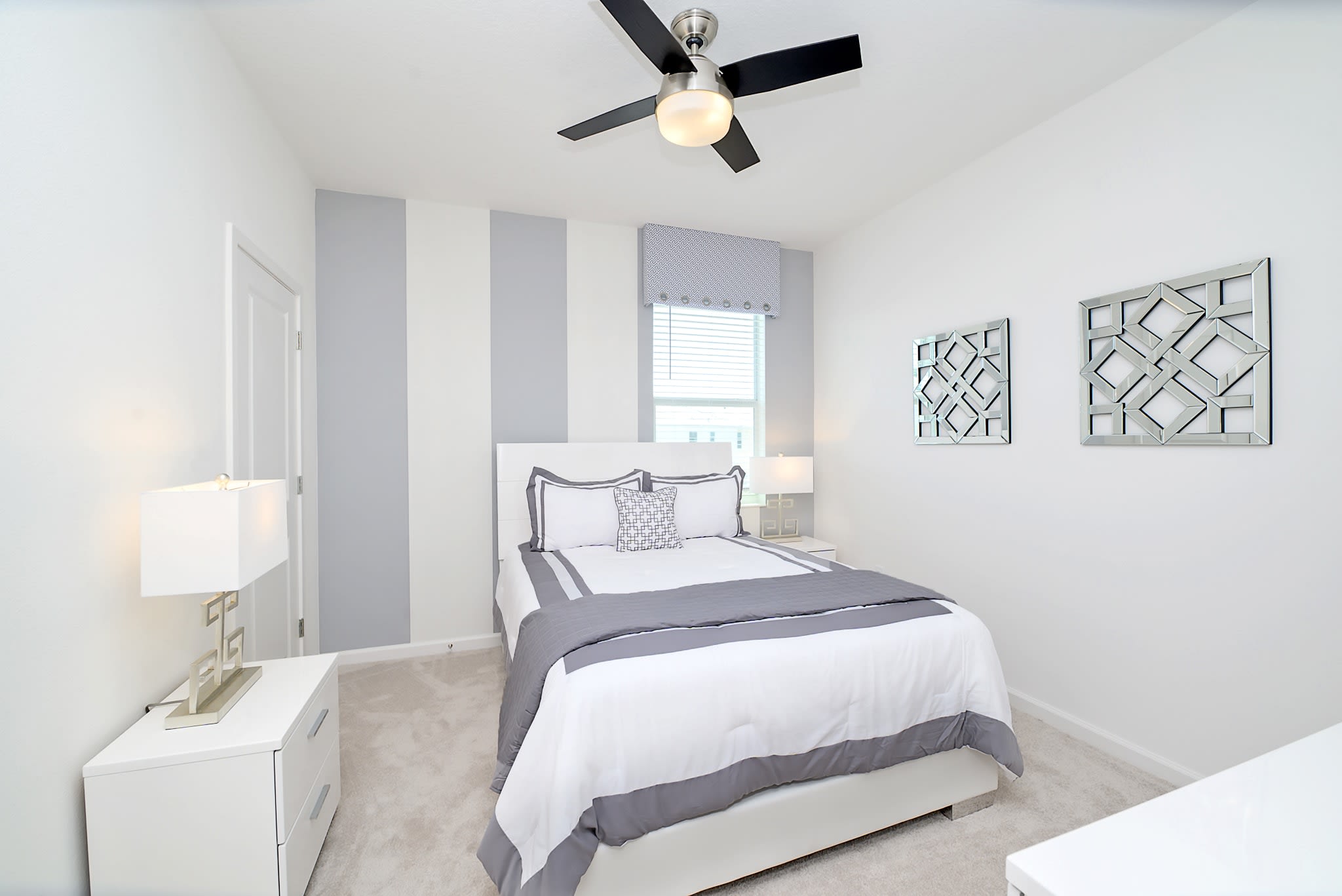 Bright Bedroom Featuring A Queen-Sized Bed And Minimalist Design