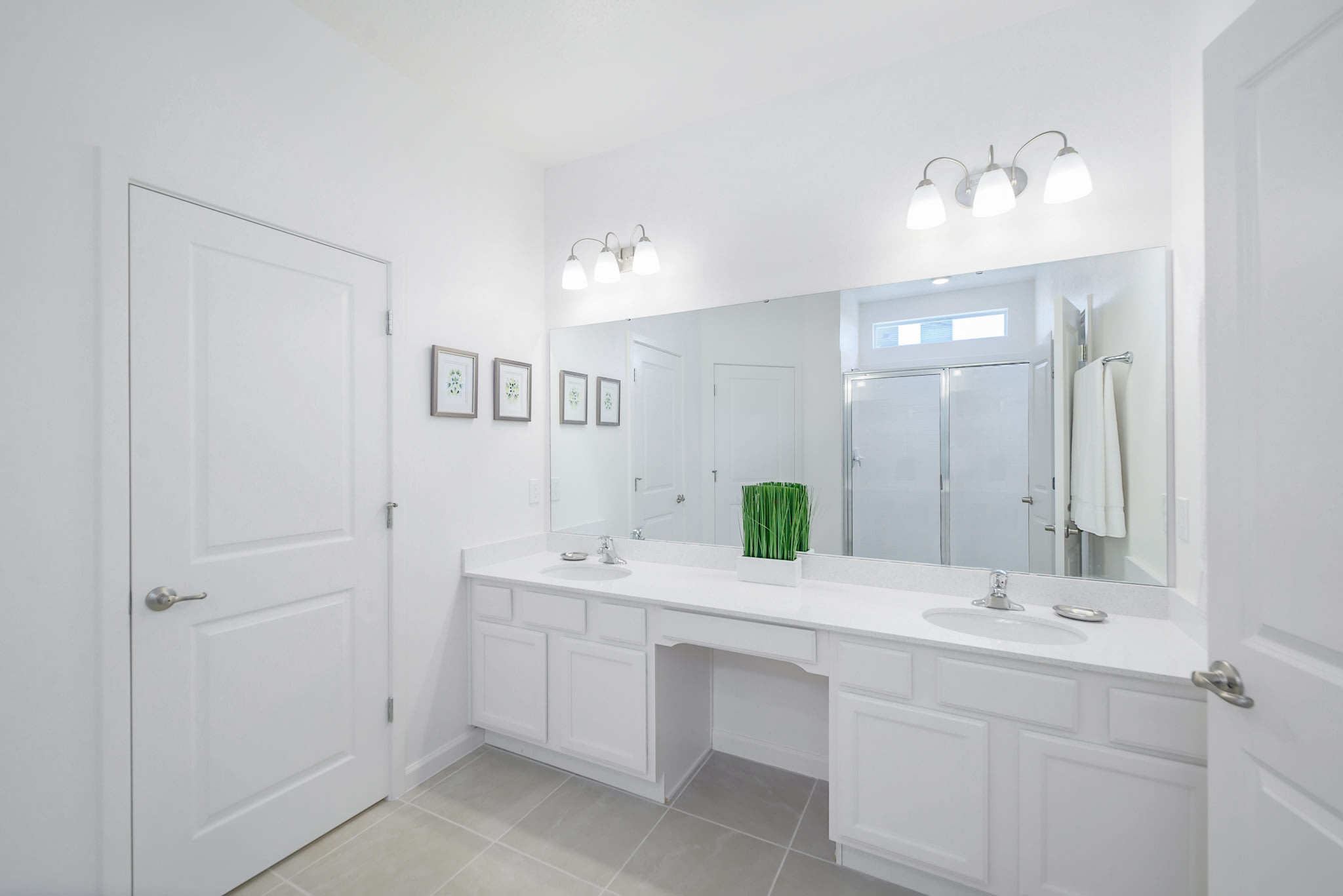 Elegant Bathroom Featuring Dual Sinks And Sleek Design