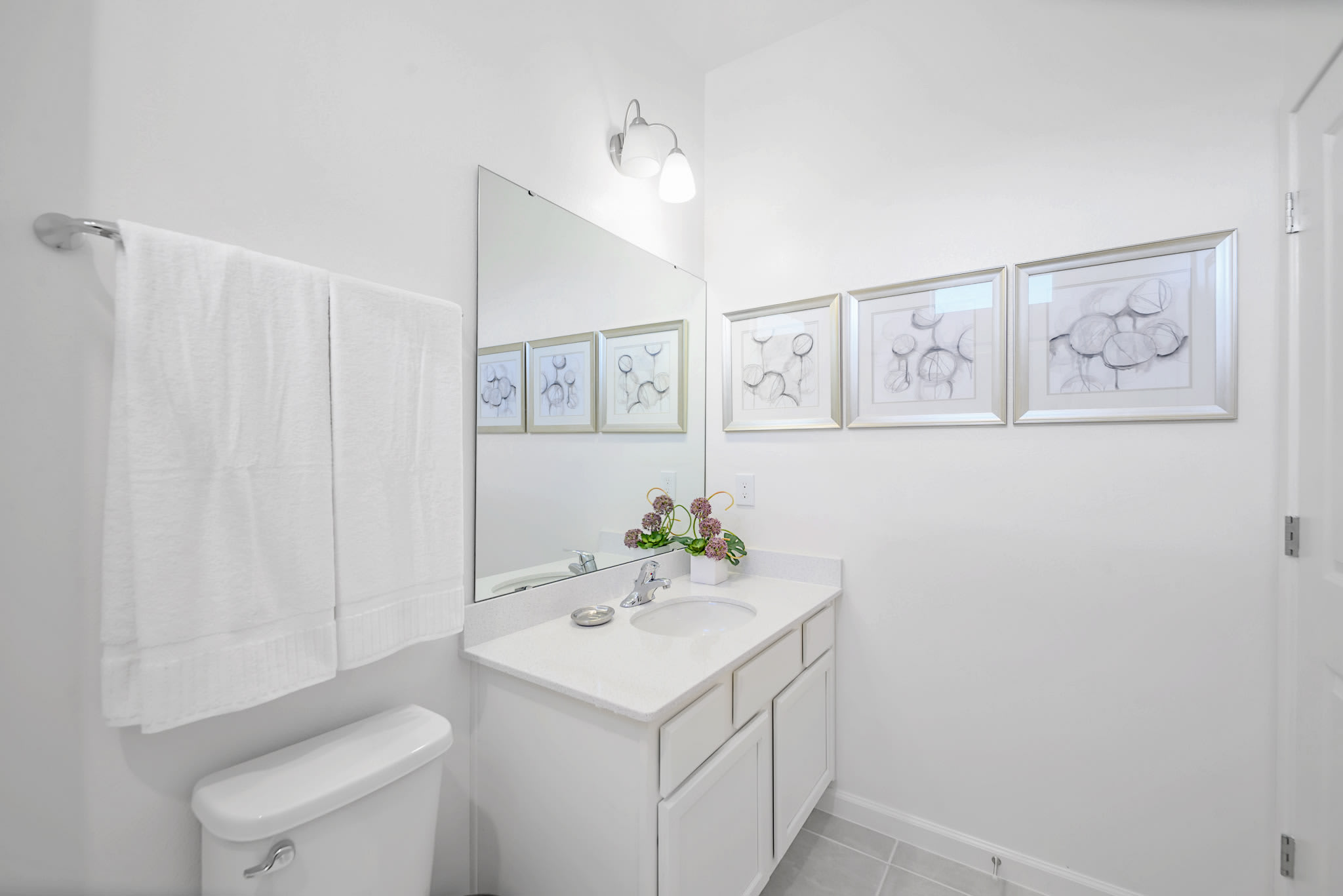 Modern Bathroom Featuring A Glass-Enclosed Shower And Sleek Vanity