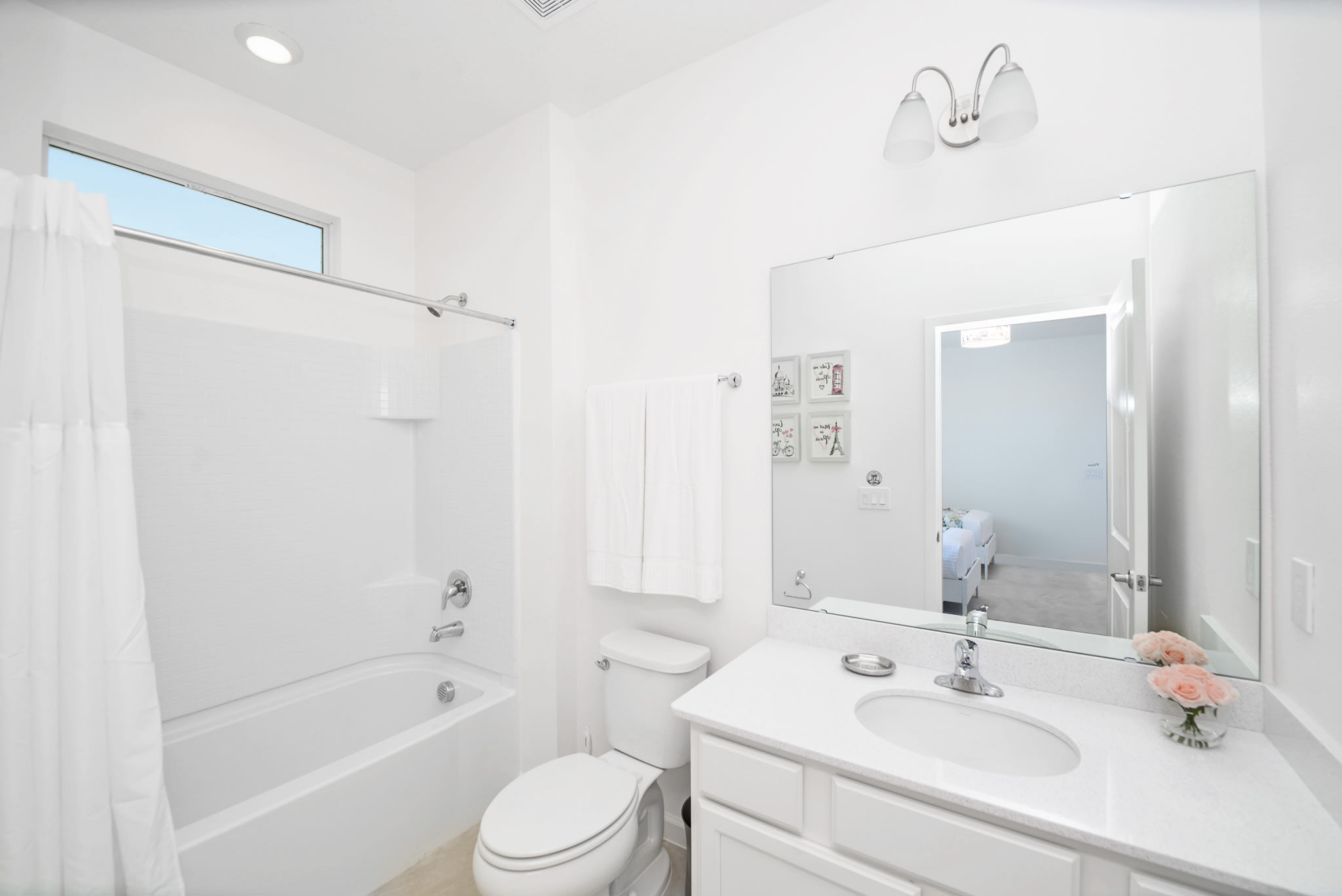 Bright Bathroom Featuring A Shower And Tub Combination With Clean Design