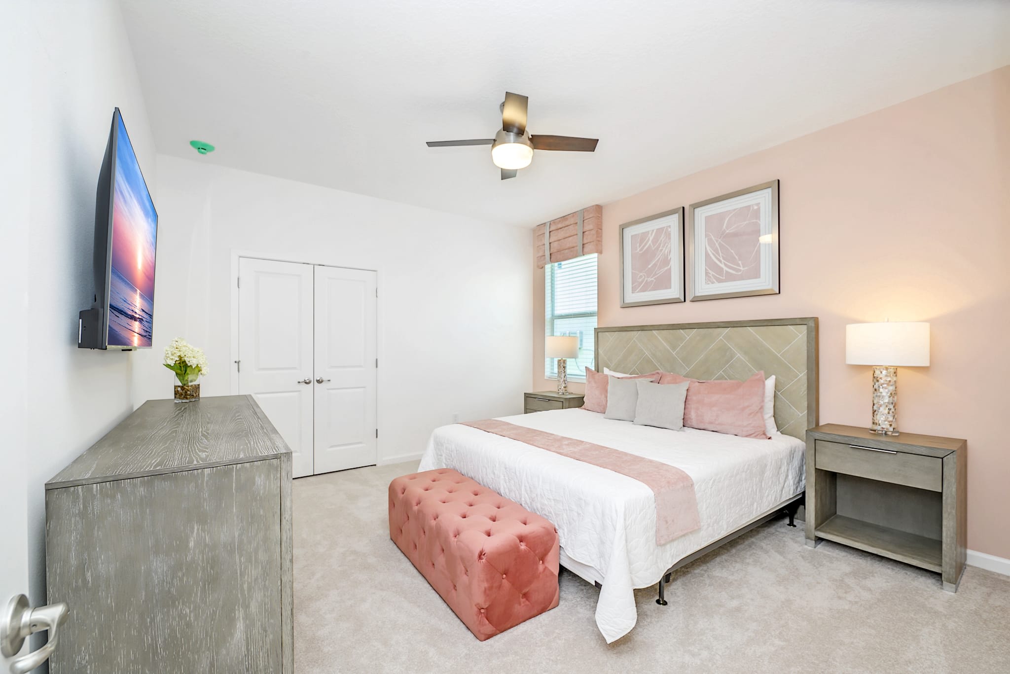 Elegant Bedroom Featuring A King-Sized Bed And Soft Pink Accents