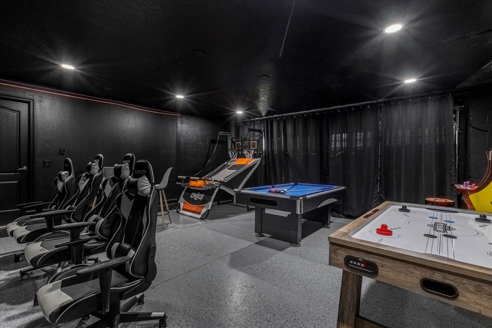 In-home game room arcade with billiards, air hockey, arcade basketball, and more