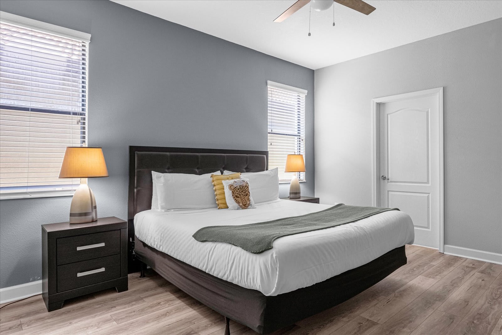 Elegant King Bed Surrounded By Classic Furniture And Natural Lighting