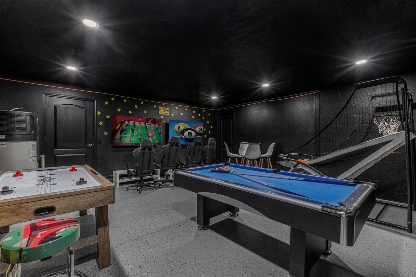 In-home game room arcade with billiards, air hockey, arcade basketball, and more