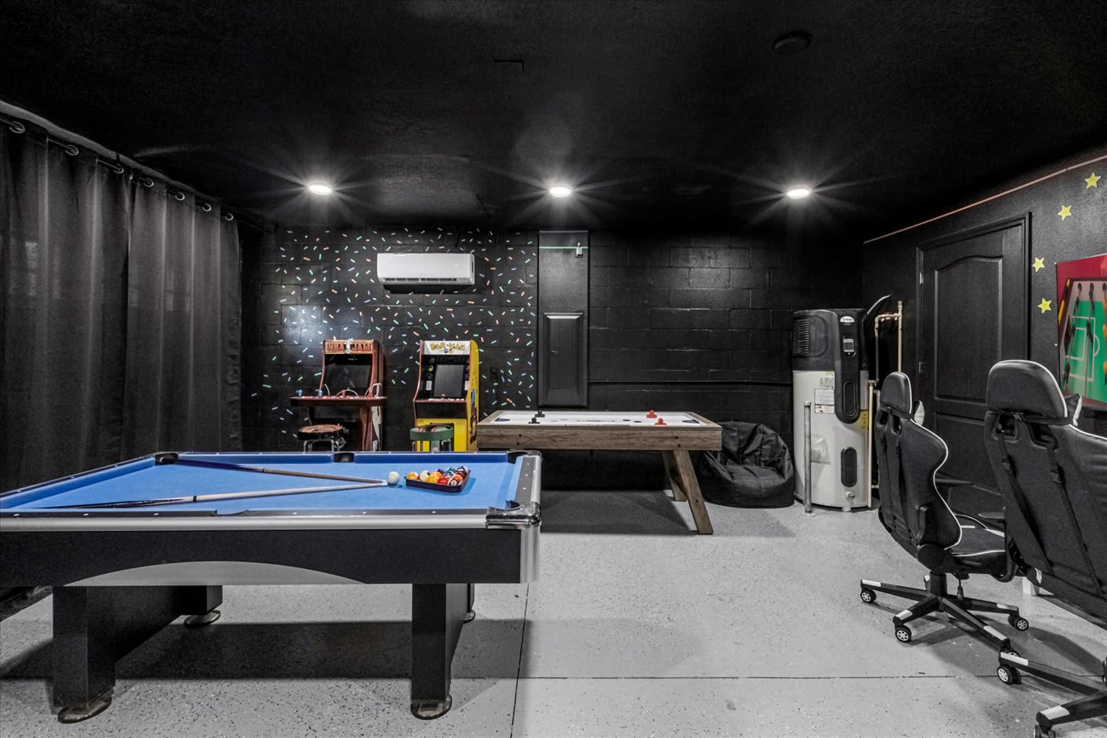 In-home game room arcade with billiards, air hockey, arcade basketball, and more