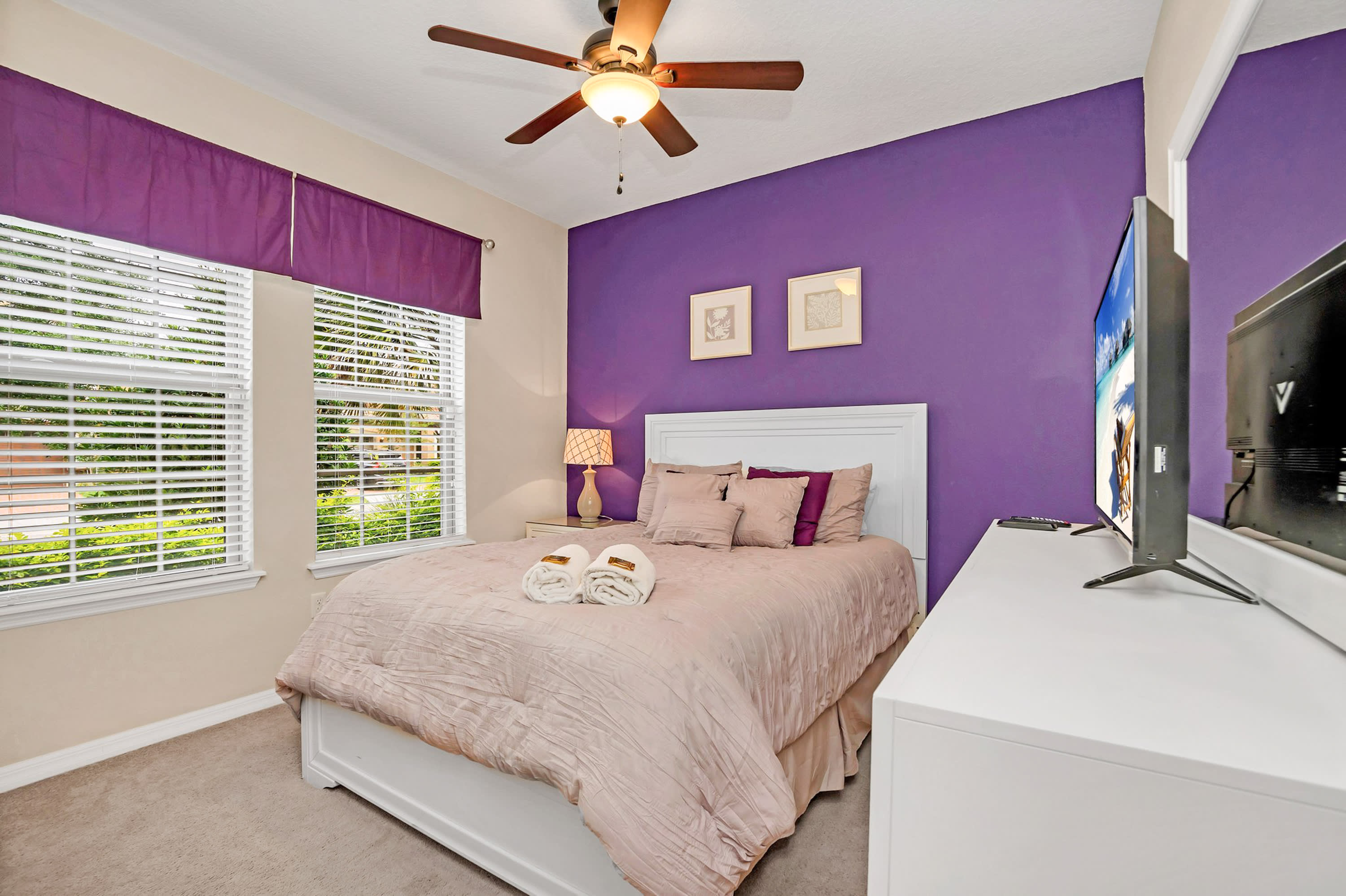 Vibrant Queen Bedroom With Purple Accents And Natural Light