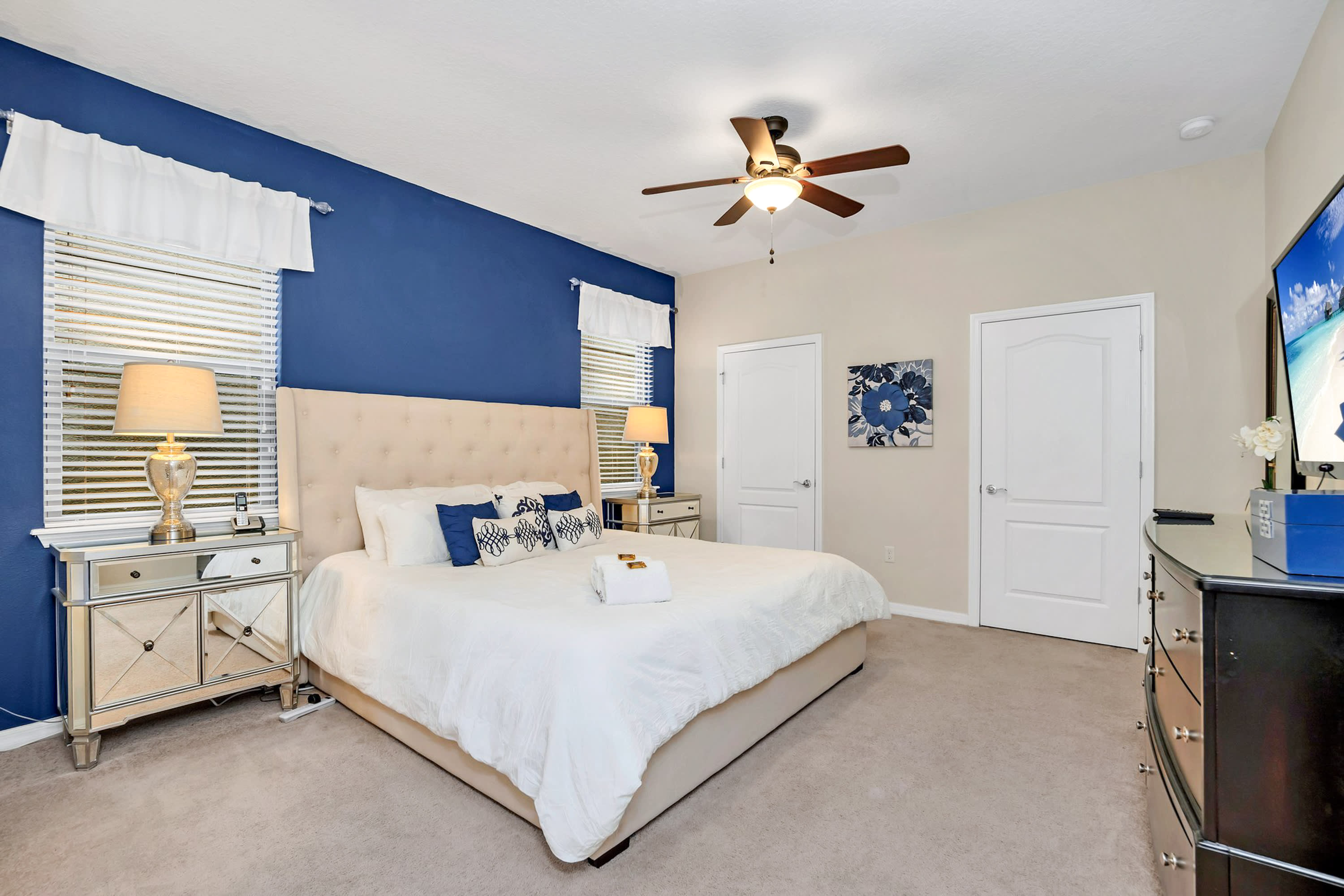 Elegant Master Bedroom With King Bed And Stylish Blue Accents