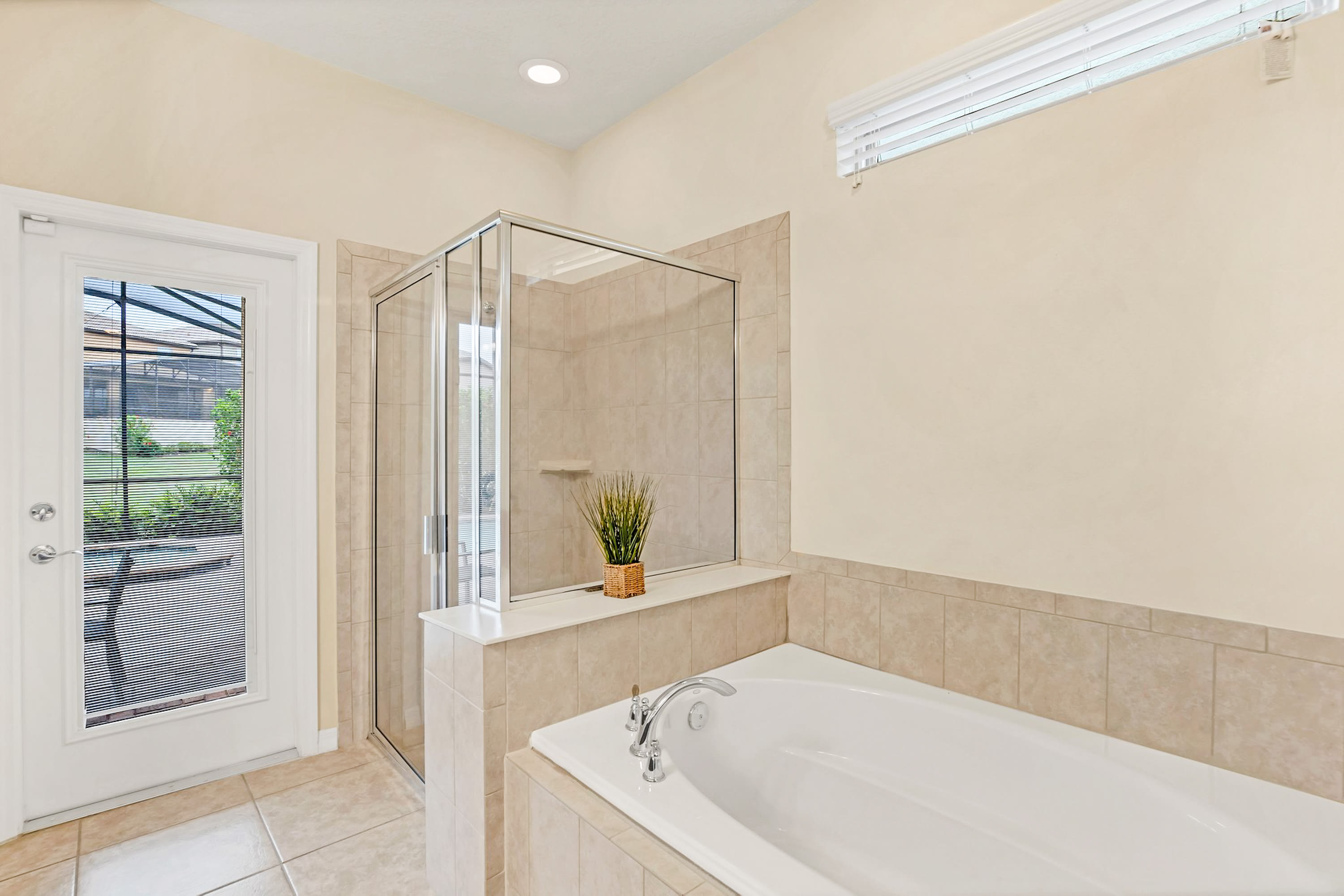 Relaxing Bathroom With Large Soaking Tub And Elegant Fixtures