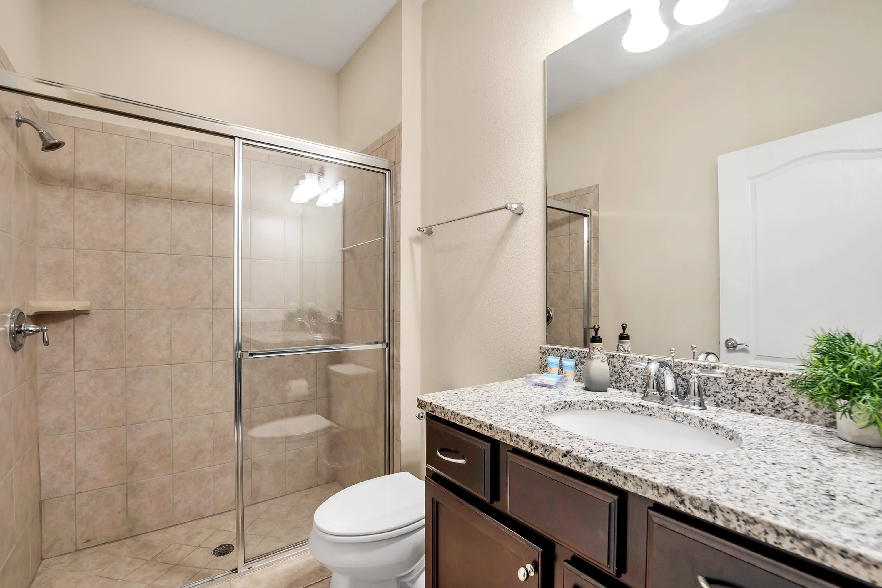 Elegant Bathroom With Contemporary Fixtures And Granite Details