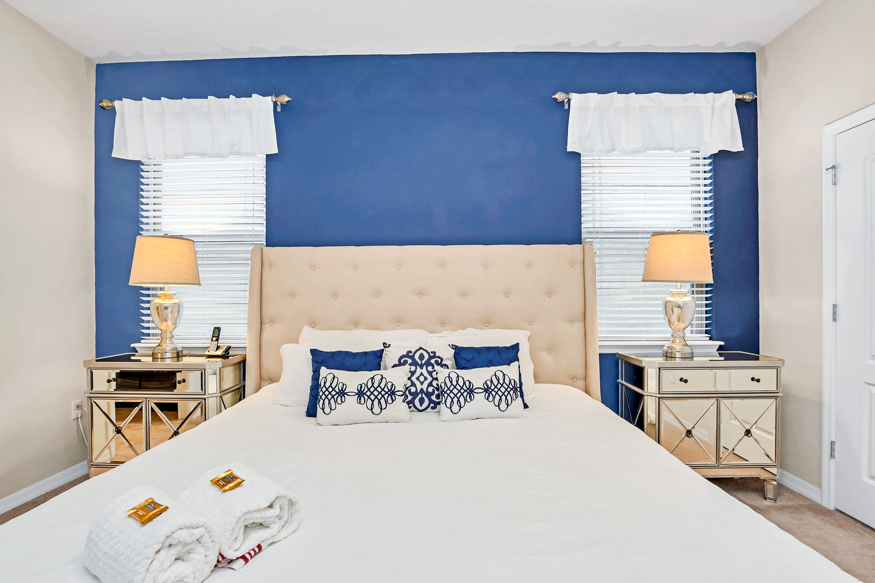Elegant Master Bedroom With King Bed And Stylish Blue Accents