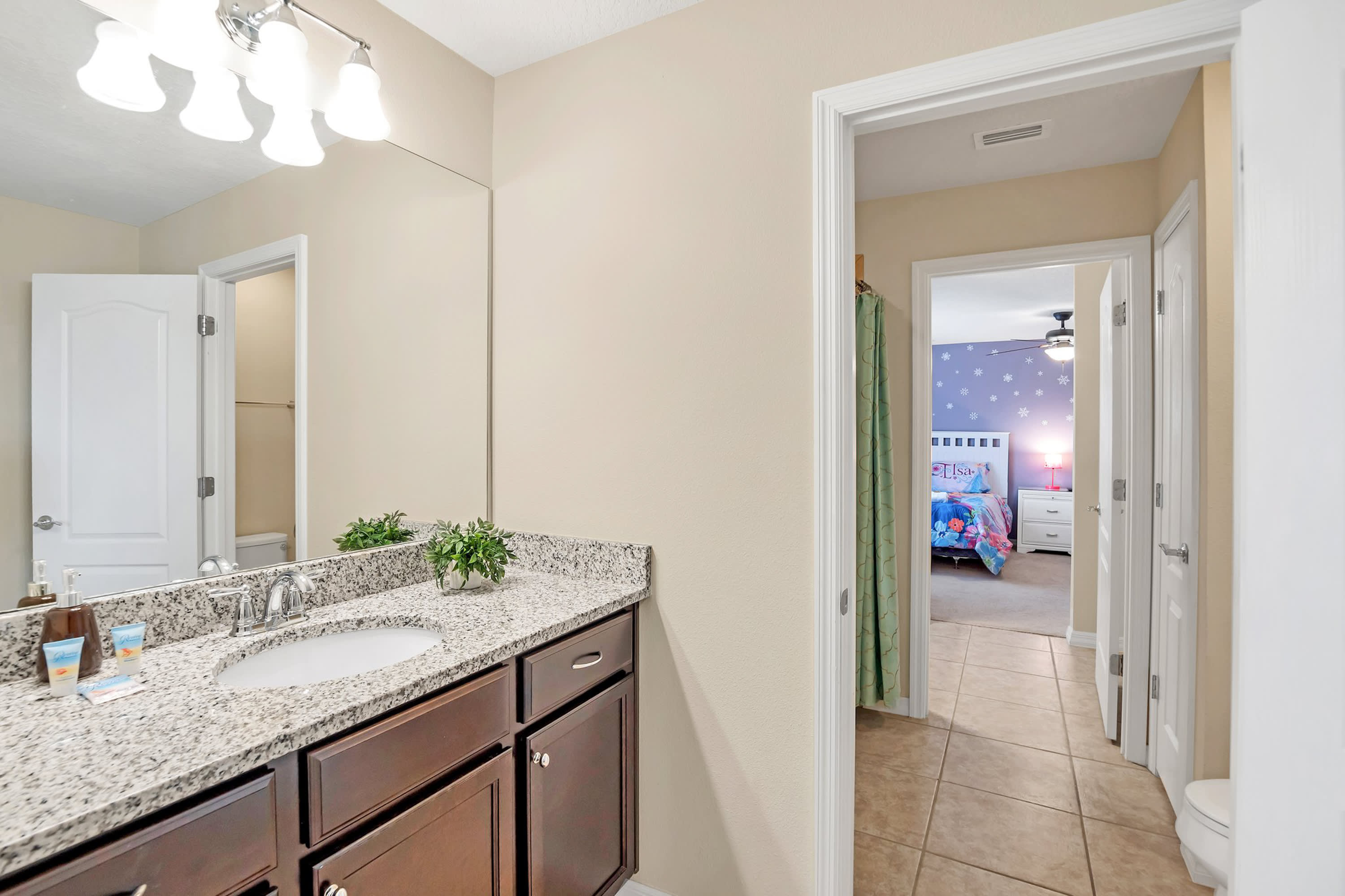 Elegant Bathroom With Contemporary Fixtures And Granite Details