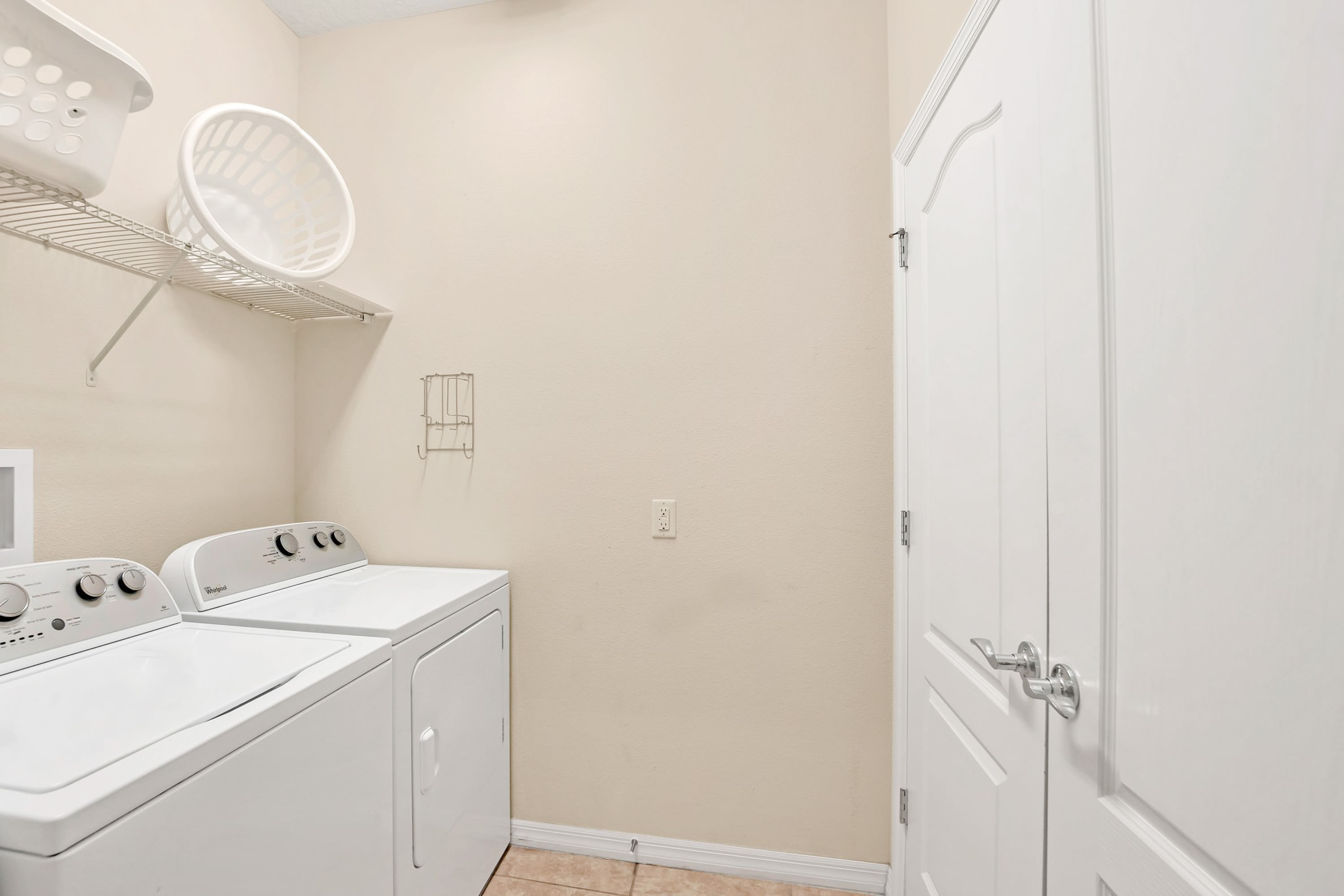 In-House Laundry Room With Modern Washer And Dryer