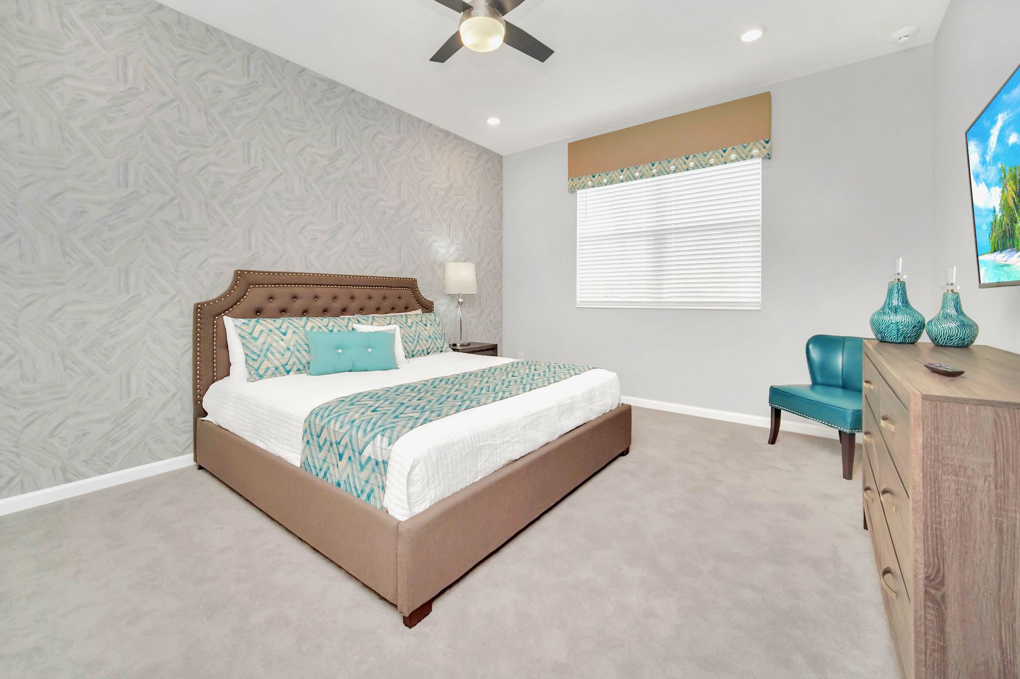 Expansive King Bedroom Featuring Sleek Design And Smart TV