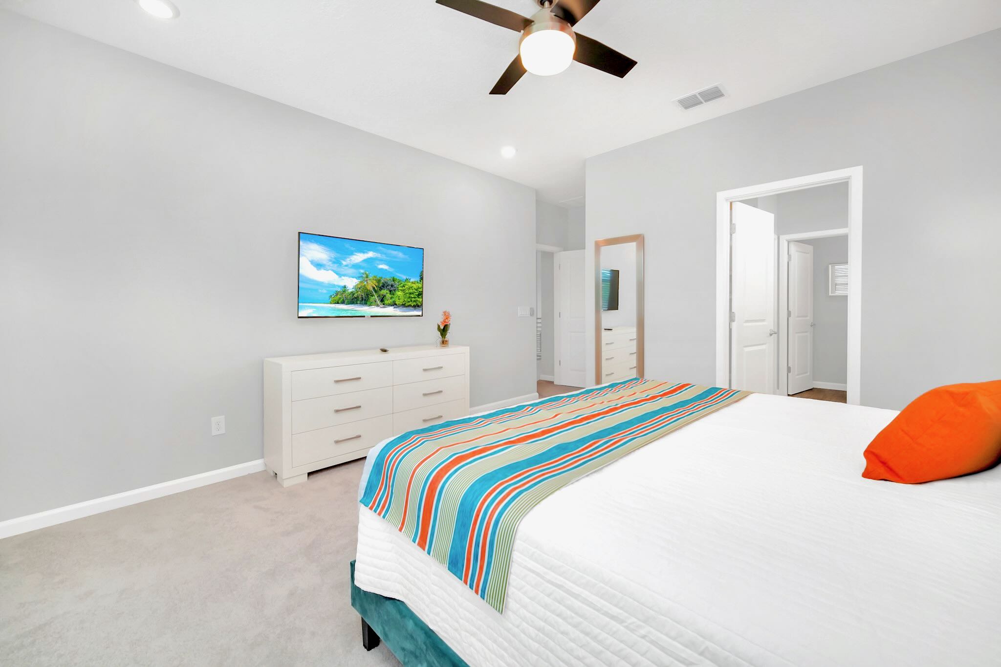 Expansive King Bedroom Featuring Sleek Design And Smart TV